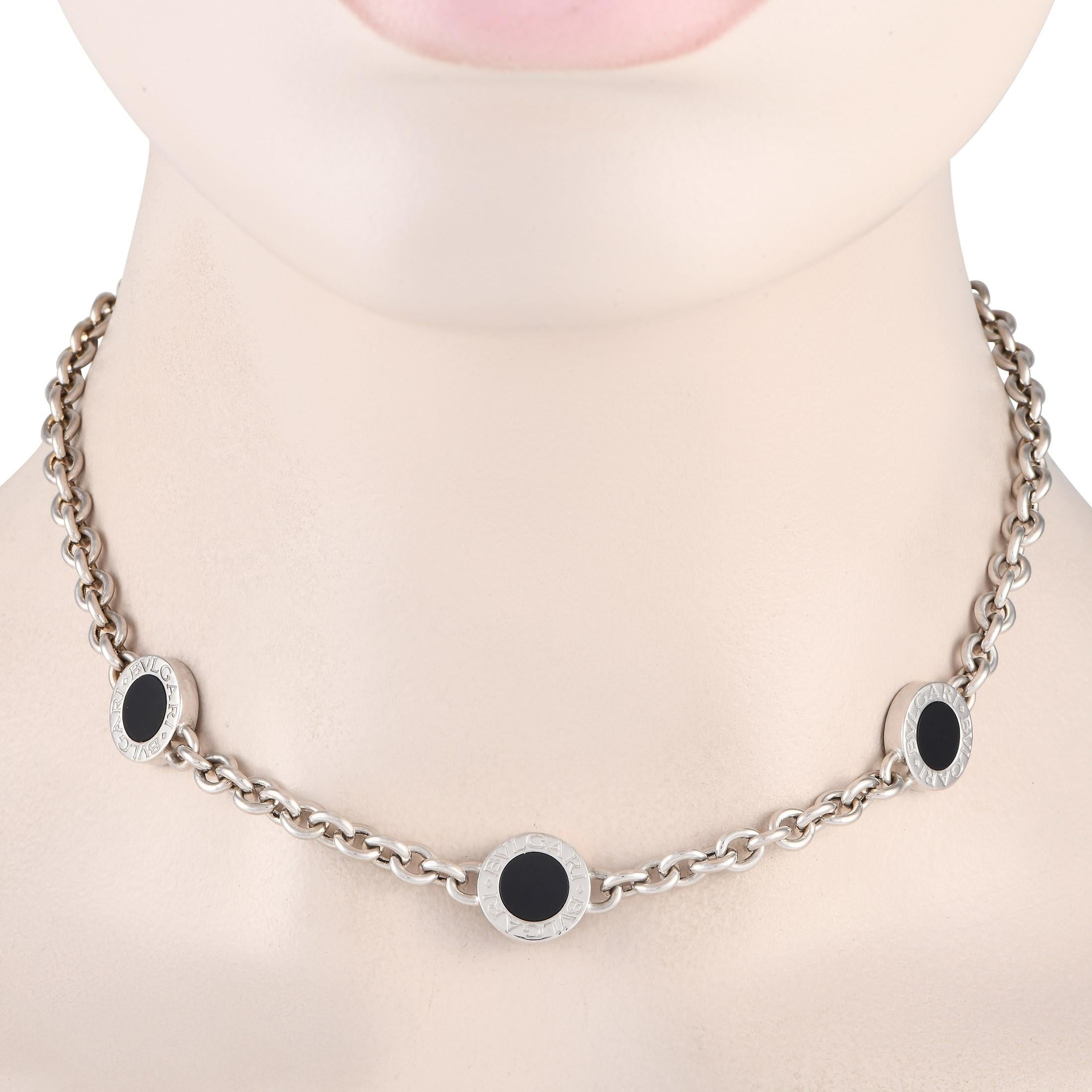 A statement-making round chain link necklace to add to your collection. This piece from Bvlgari features a thick chain link necklace punctuated with three Bvlgari Bvlgari discs, each with a round onyx inlay. The chain measures 15.5 inches long and
