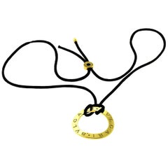 Bvlgari Bvlgari 18 Karat Yellow Gold Round Open Necklace, Black Silk Cord