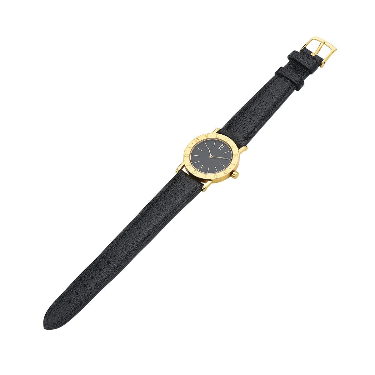 This BVLGARI BB#30 features a black dial with an 18K yellow gold high polish case. Currently mounted on a brand new unworn Italian leather BVLGARI tumbled leather strap. Sapphire crystal glass. 