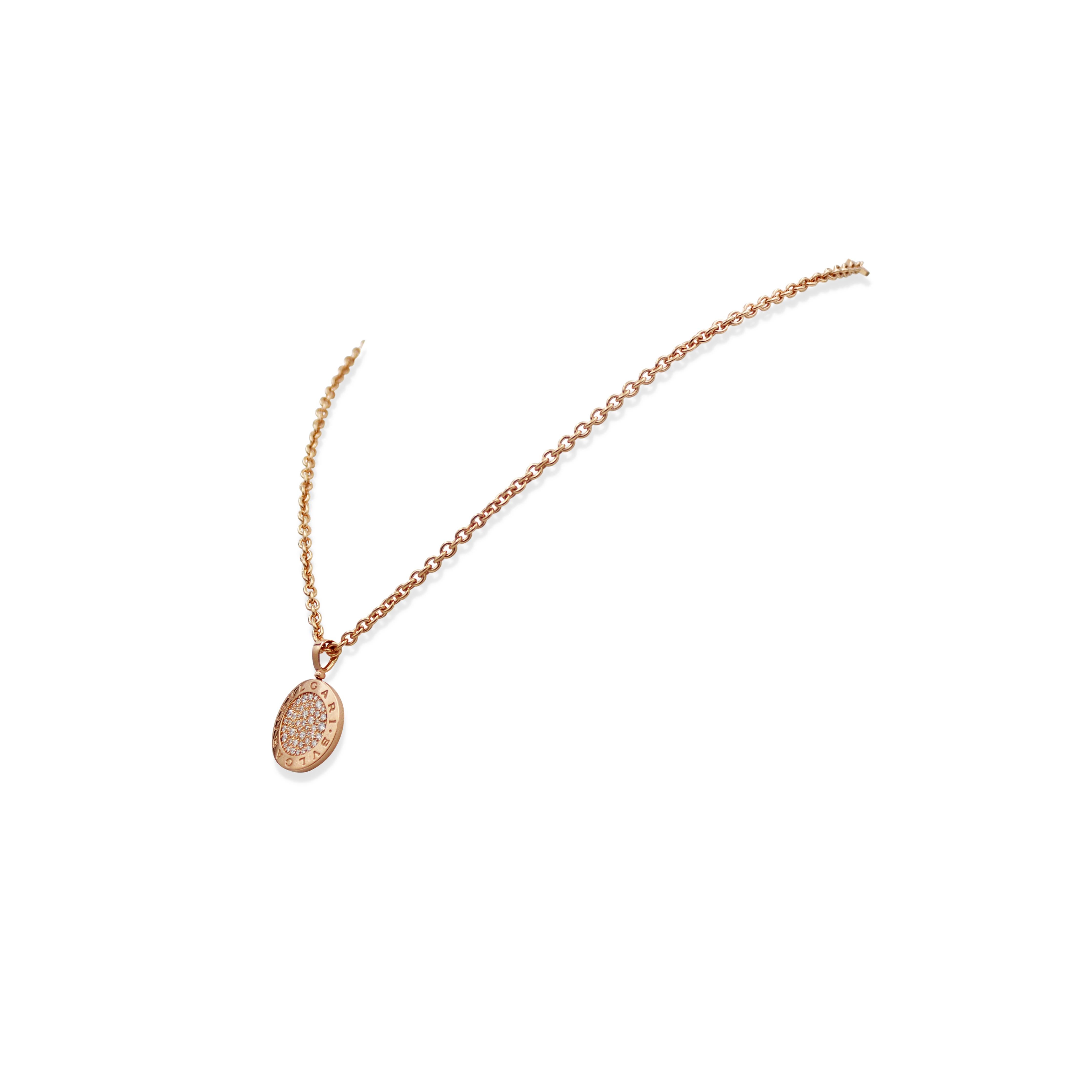Authentic Bvlgari pendant necklace crafted in 18 karat rose gold. The curved disc-shaped pendant features Bvlgari's trademark double logo and is set at the center with an estimated 1.00 carats of pavé round brilliant cut diamonds and hangs from an