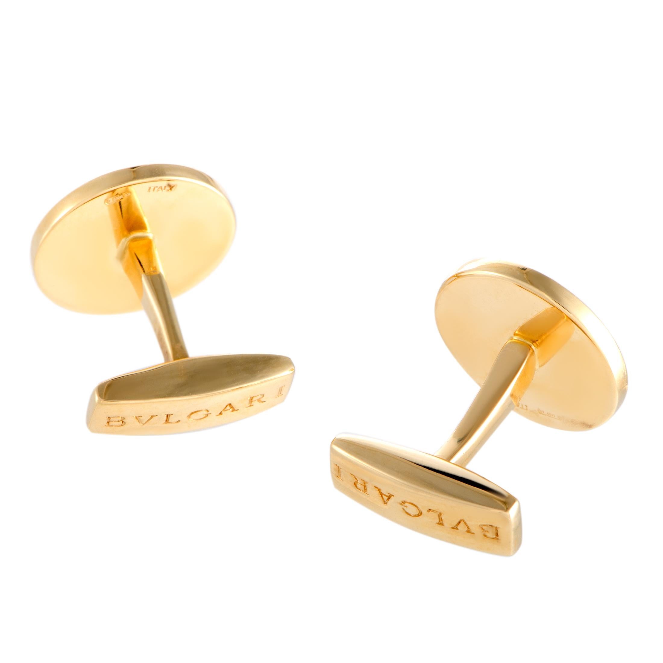 These classy cufflinks by Bulgari compel with their remarkable design. The glamorous pair features a gold circle engraved with the characteristic double logo 