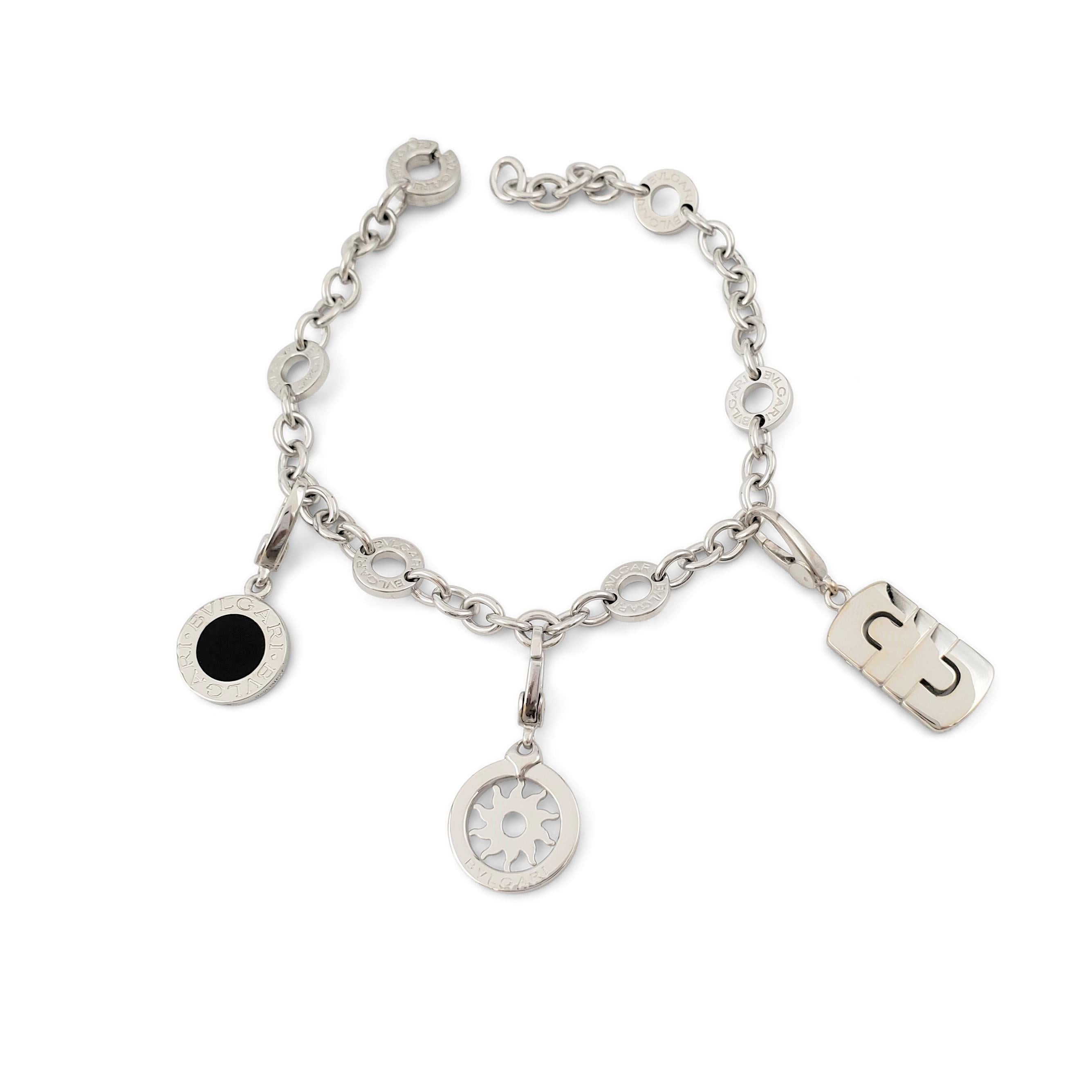 Authentic Bvlgari 'Bvlgari-Bvlgari' charm bracelet crafted in 18 karat white gold features three iconic Bvlgari charms. Signed Bvlgari, 750, Made in Italy with serial number. The bracelet is presented with the original box, no papers. CIRCA