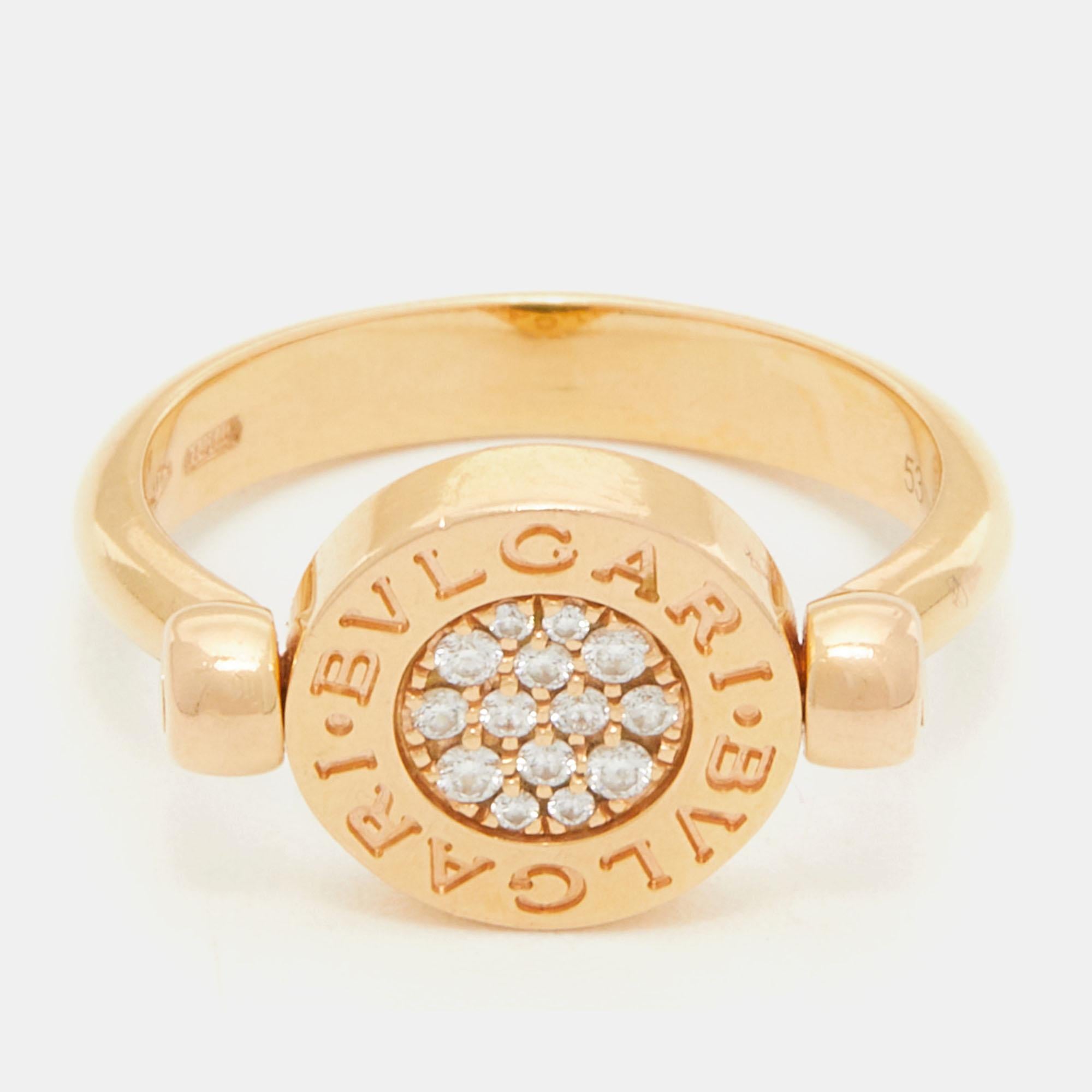The Bvlgari Bvlgari logo of the brand—a characteristic feature of the Bvlgari designs—was inspired by the inscriptions on ancient coins. With history engraved on the very face, this beautiful ring delivers a harmonic balance of ethereal 18k rose