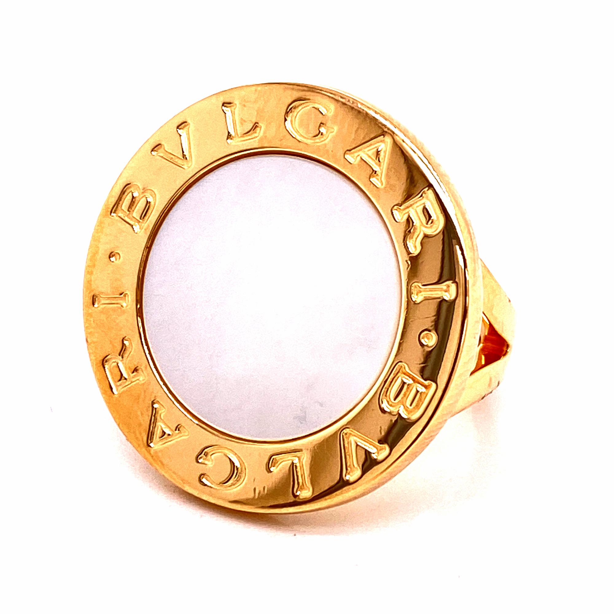 Bvlgari Bvlgari Signature Mother of Pearl 18 Karat Yellow Gold Ring. The ring features an inlay of mother of pearl surrounded by the Bvlgari signatures. The ring is size 6.5, and measures 25 x 25mm. 