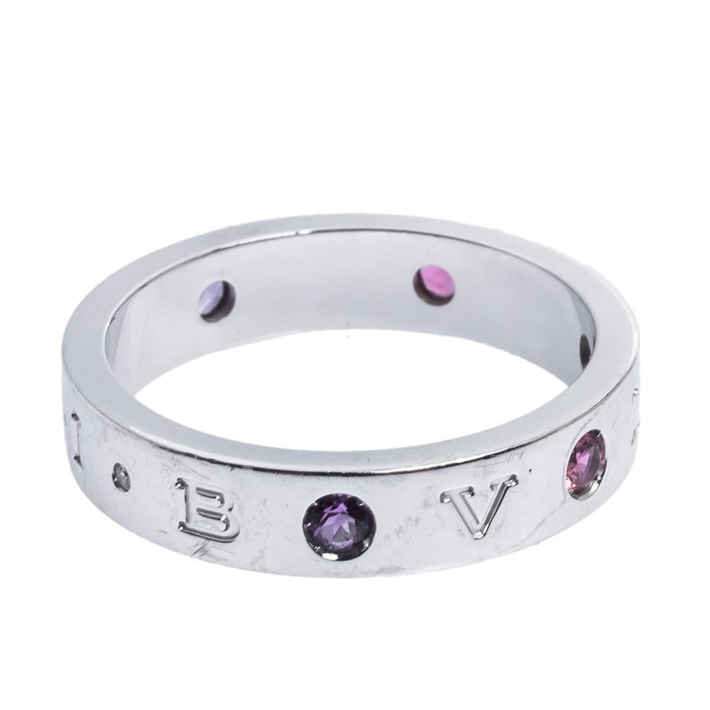 It is definitely love at first sight with this Bvlgari ring. Beautifully crafted from 18k white gold, it comes designed in a band silhouette. The ring flaunts an assembly of multicolored gemstones and a diamond along with 'Bvlgari-Bvlgari'