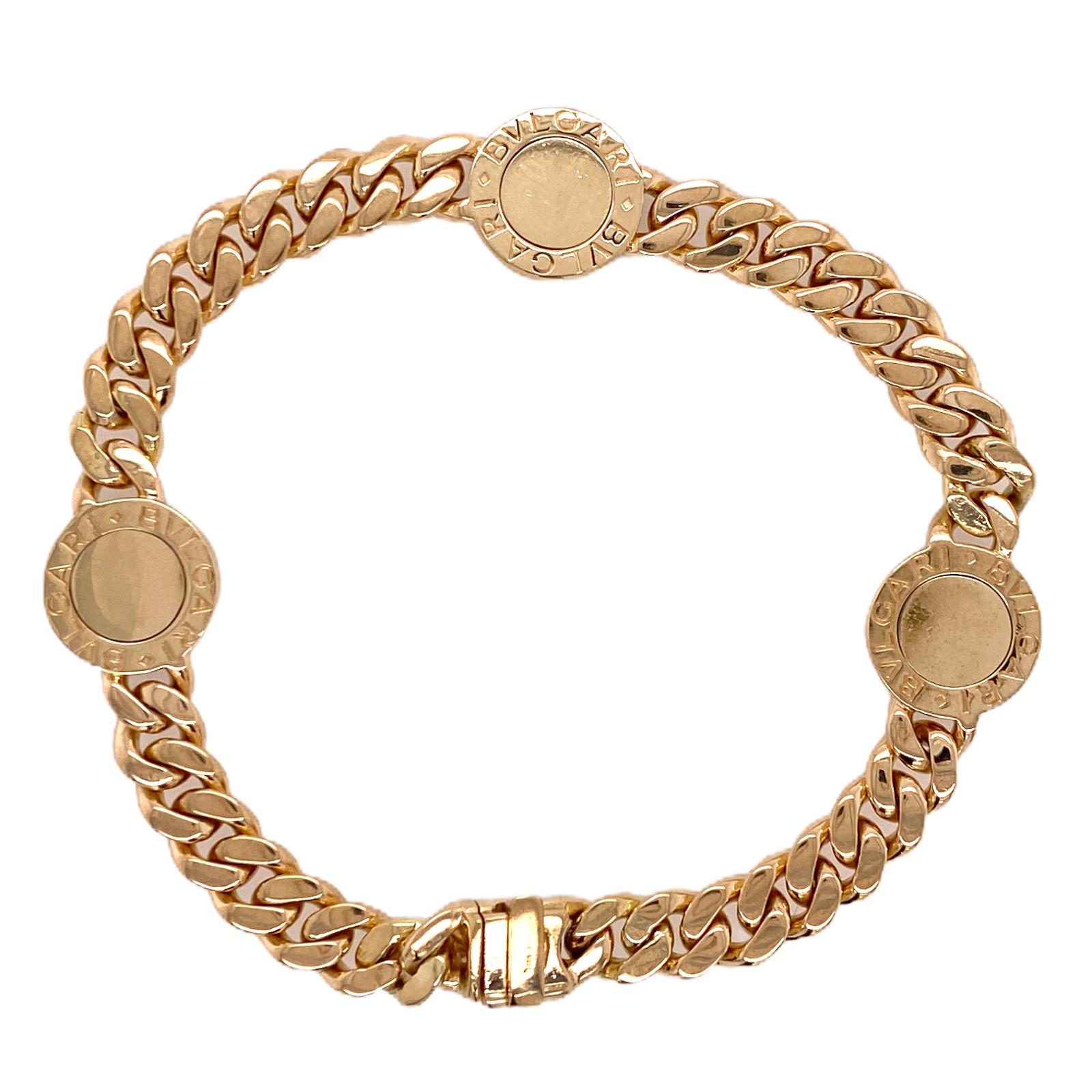 The original BVLGARI BVLGARI onyx curb link bracelet circa 1970's is fashioned in 18 karat yellow gold and is reversible. This bracelet is heavier than the newer models, measures 7.5 inches in length, and the discs measure 12.8 mm in diameter