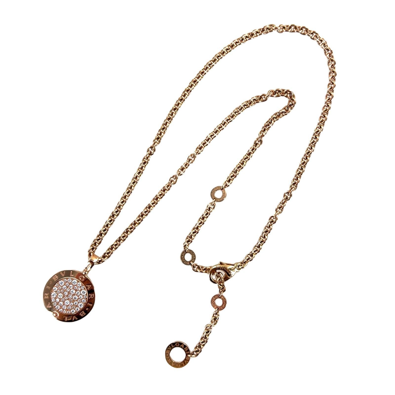 This luxurious 18k rose gold Bvlgari Bvlgari necklace features a signature round pendant adorned with 52 pavé-set round brilliant-cut diamonds, radiating exquisite brilliance. The pendant measures 20mm in diameter and showcases the iconic 