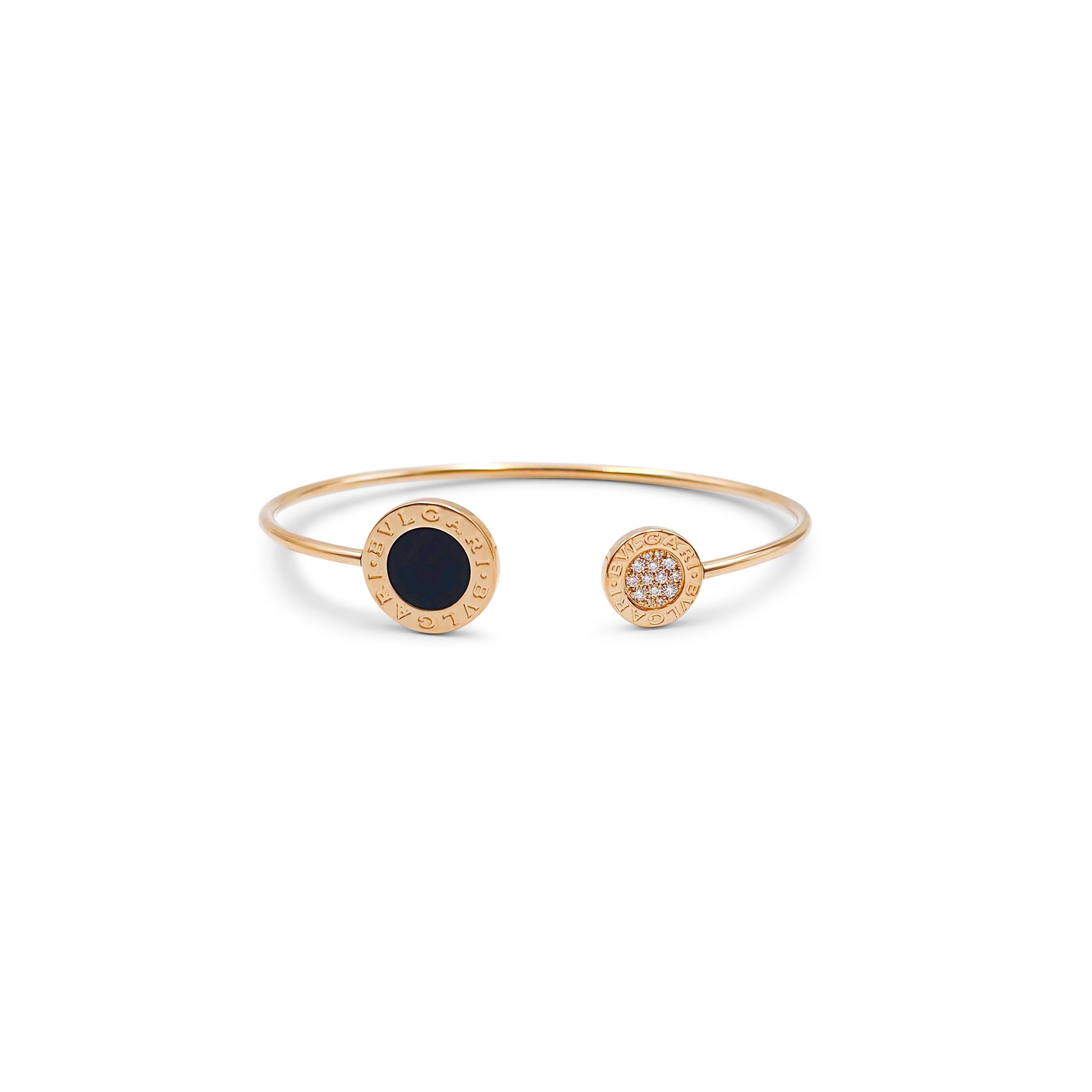 Authentic Bvlgari bracelet from the Bvlgari Bvlgari collection crafted in 18 karat rose gold.  This sleek narrow bangle features the double Bvlgari logo at either end of the split opening.  One end is set with onyx, the other is set with