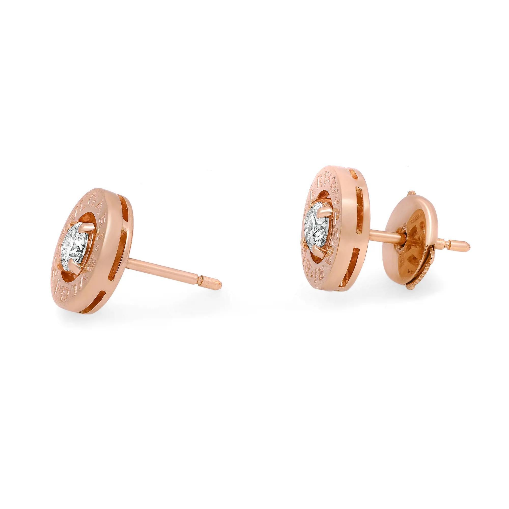 These dazzling diamond earrings from the house of Bvlgari are a perfect addition to your jewelry collection. Crafted in fine 18K rose gold, it features a center prong set round brilliant cut diamond with engraved Bvlgari logo on the outer rim. Total