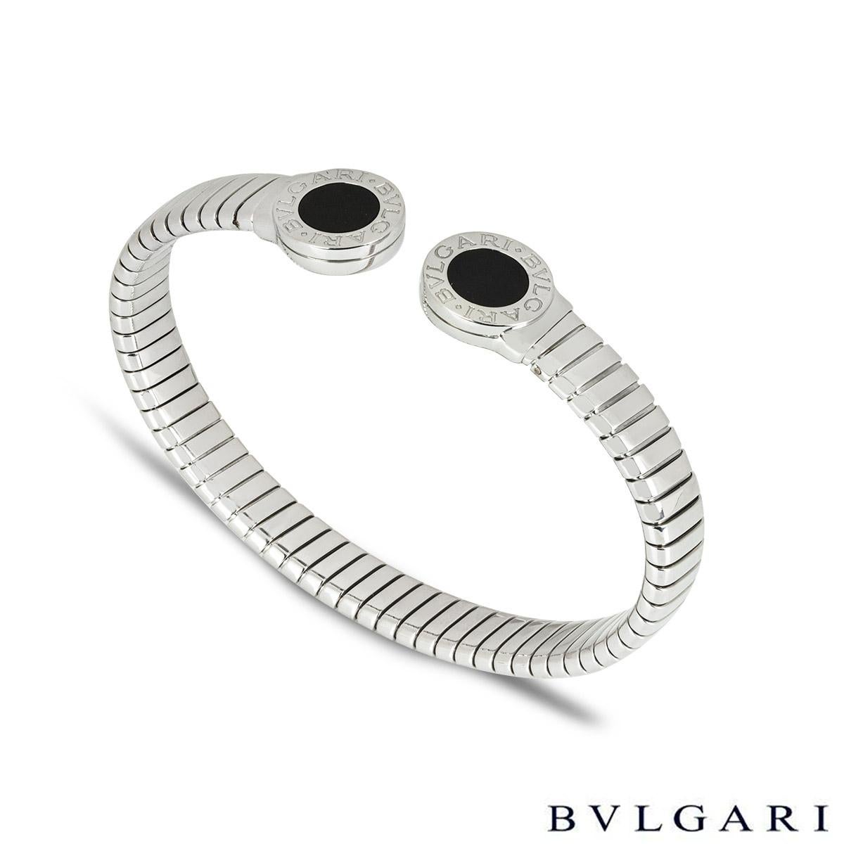 A chic stainless steel bracelet by Bvlgari from the Bvlgari Bvlgari collection. The cuff-style bracelet is set with 2 circular onyx inlays engraved with 'Bvlgari Bvlgari' around the edge. The Tubogas bracelet measures 8.4mm wide, is a size M which