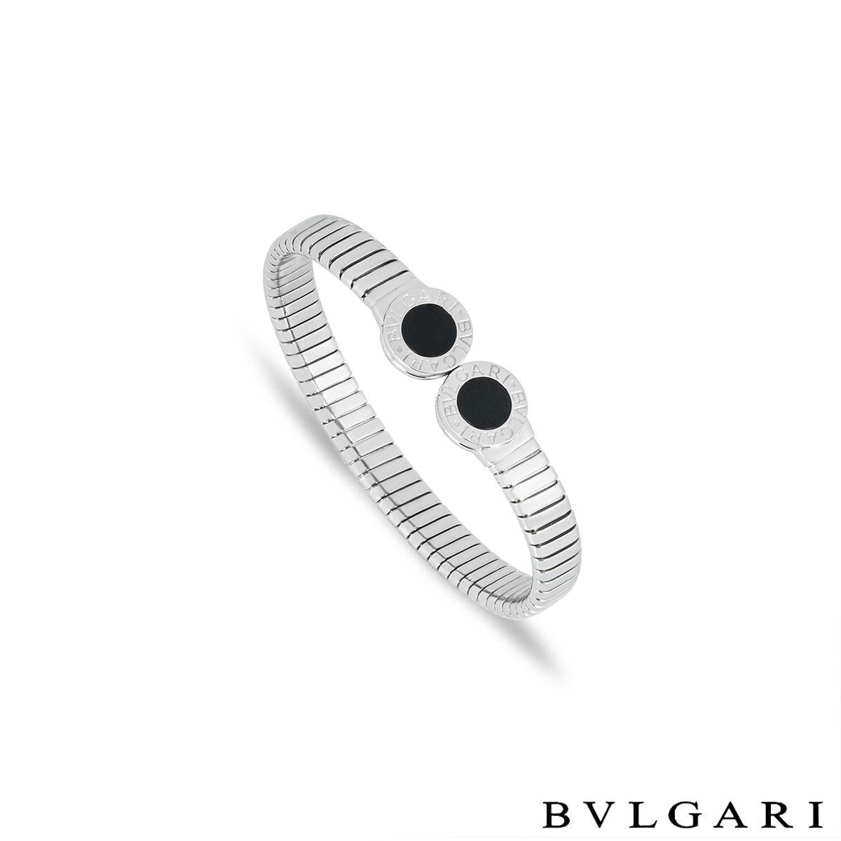 A chic stainless steel bracelet by Bvlgari from the Bvlgari Bvlgari collection. The cuff-style bracelet is set with 2 circular onyx inlays engraved with 'Bvlgari Bvlgari' around the edge. The Tubogas bracelet measures 8.4mm wide, fits a wrist size