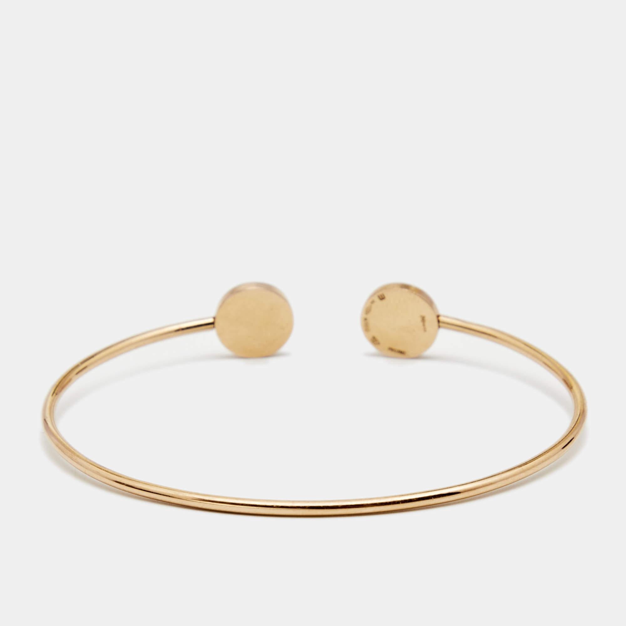 Elevate your look instantly with this Bvlgari bracelet. Crafted from 18k rose gold in a simple bangle style with an open cuff design, this piece carries two circular ends inlaid with mother of pearl and sugilite . Easy to wear and versatile in use,