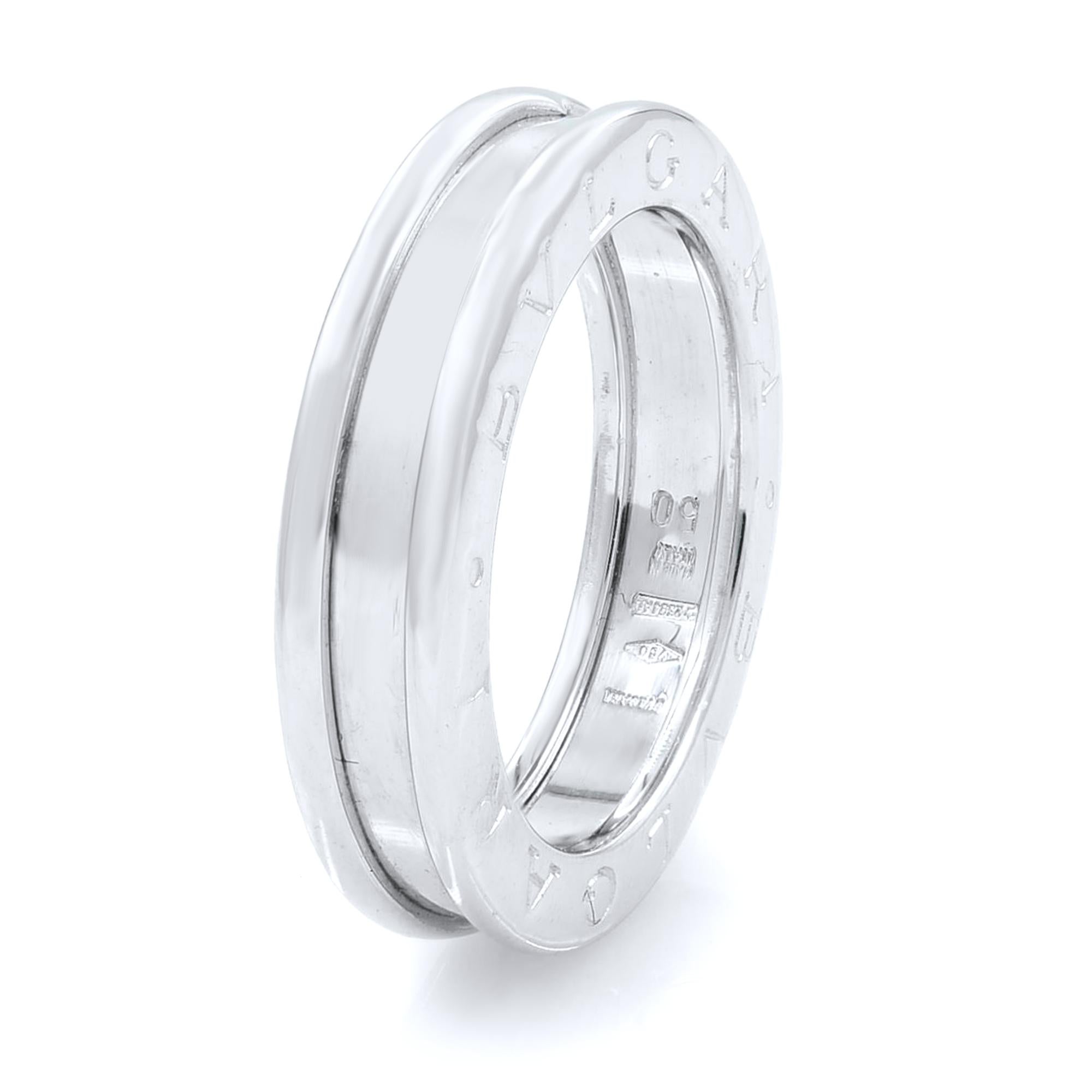 The B.Zero ring is a signature piece from the legendary jewelry design house Bvlgari. It features a clean, modern design with a white gold central band surrounded by two white gold rims with the BVLGARI logo engraved on both sides. You will love