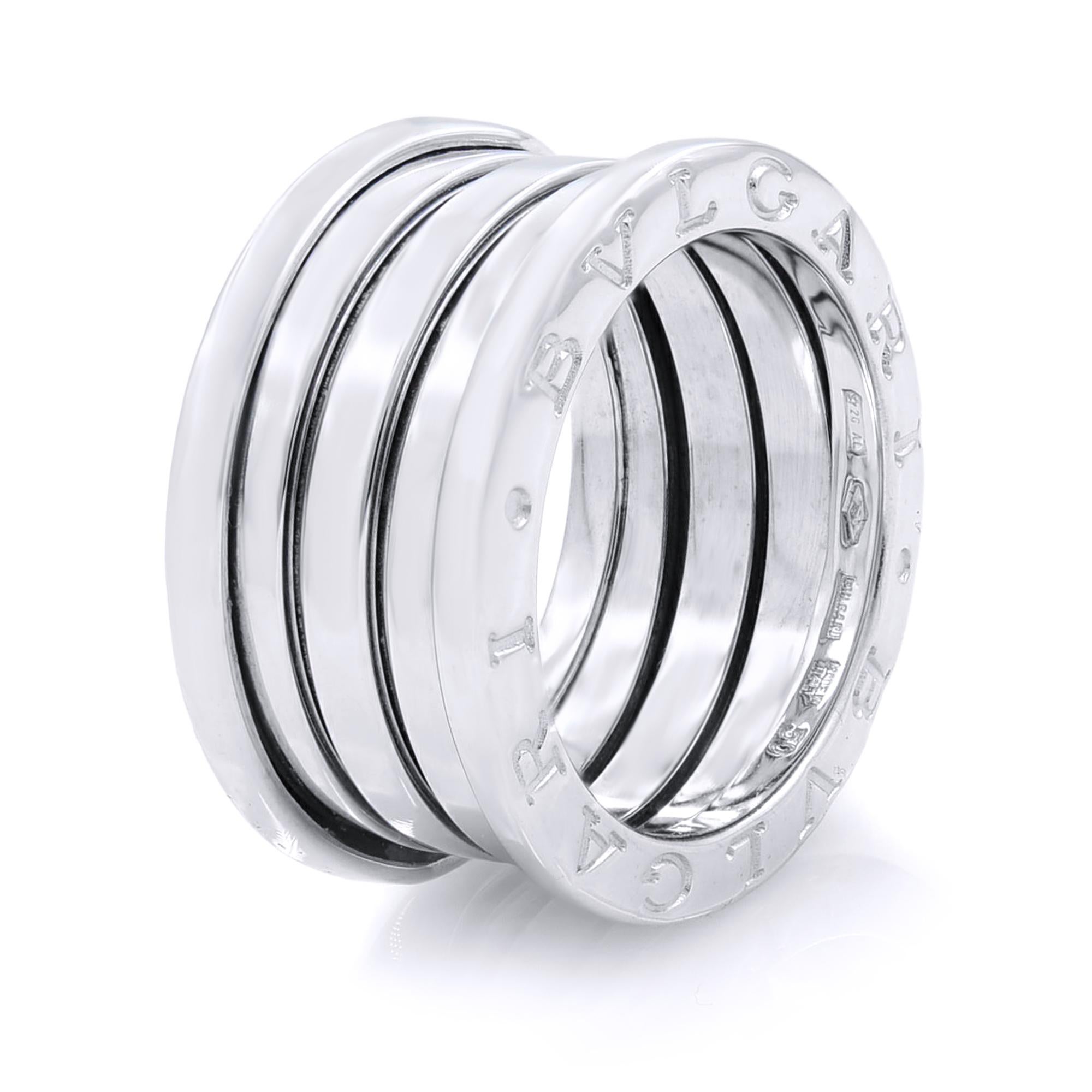 The B.Zero ring is a signature piece from the legendary jewelry design house Bvlgari. It features a clean, modern design with a white gold central band surrounded by two white gold rims with the BVLGARI logo engraved on both sides. You will love