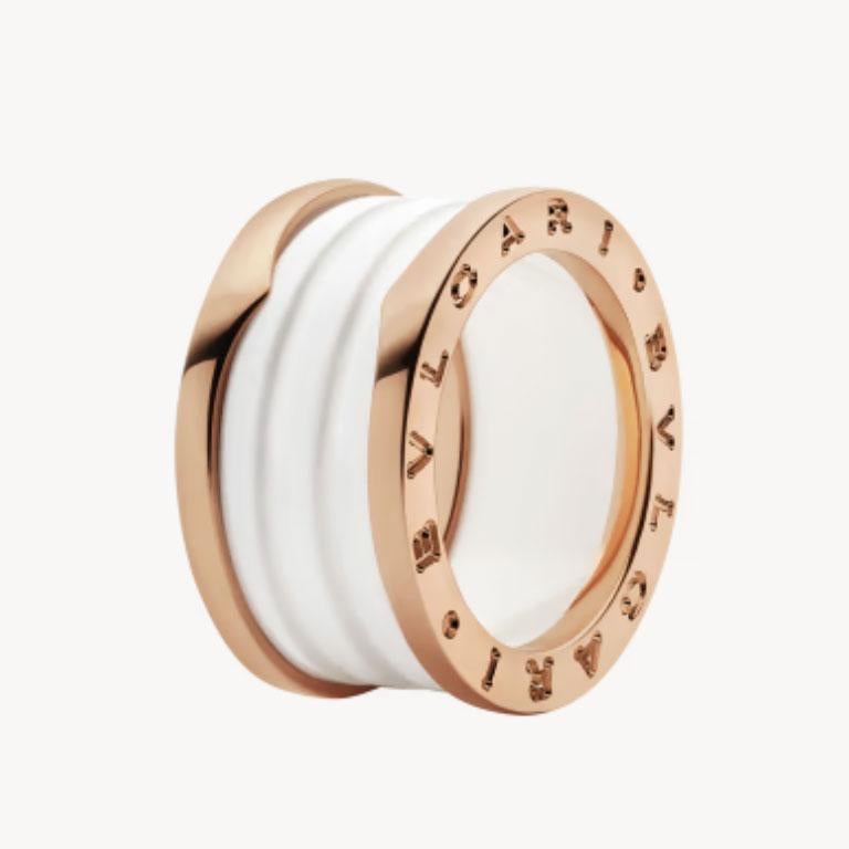 Authentic Bvlgari B.Zero 1 Ring in 18k rose gold and white ceramic. This beautiful ring features 4 bands with two 18kt rose gold loops and a white ceramic spiral, from the iconic B.Zero 1 collection. The serial number, ring size and Bvlgari