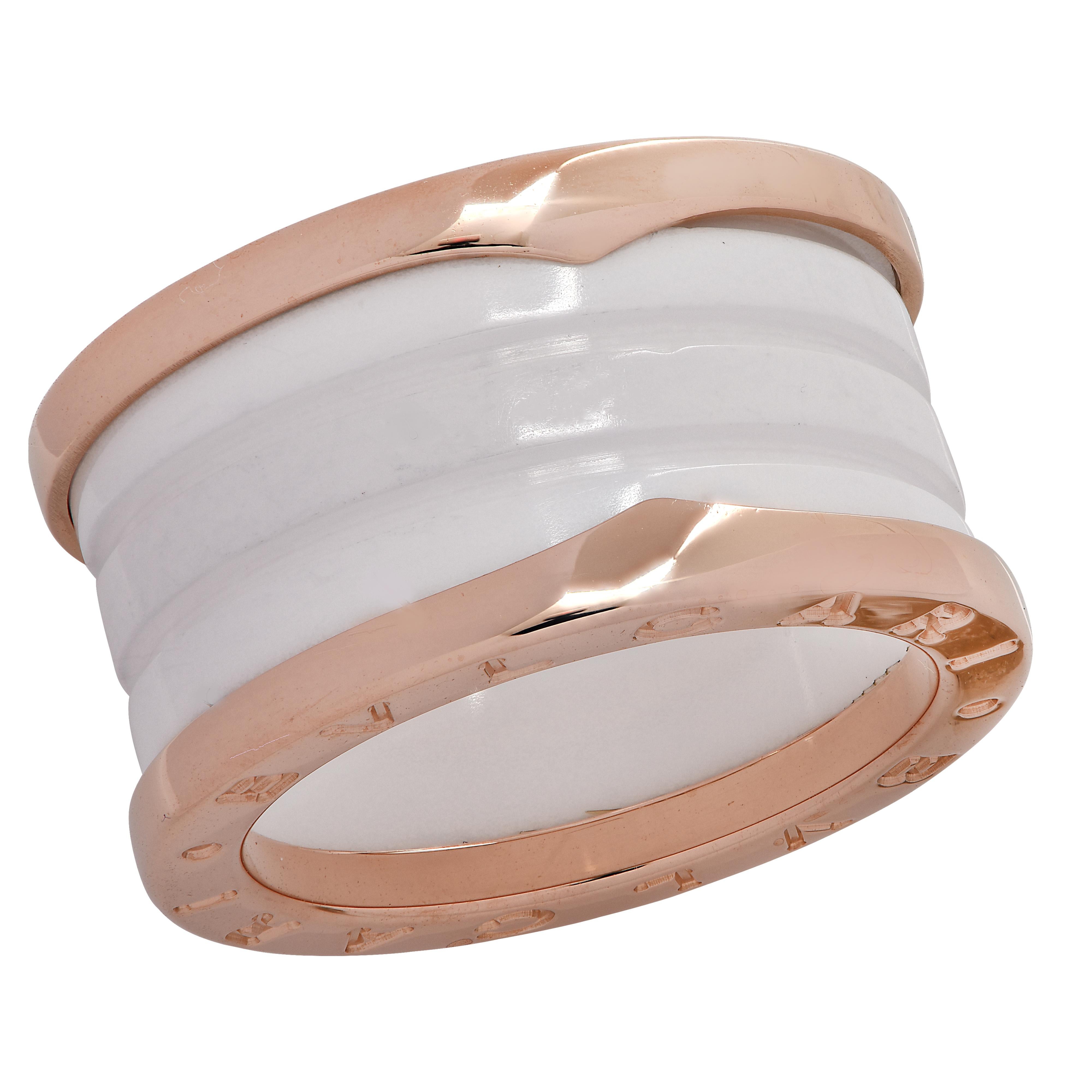 From the House of Bvlgari, this stunning band from the B.Zero 1 collection features two bands crafted in 18 karat rose gold, detailed with the Bvlgari logo, framing a white ceramic grooved band. This stunning ring measures 12 mm in width and is a