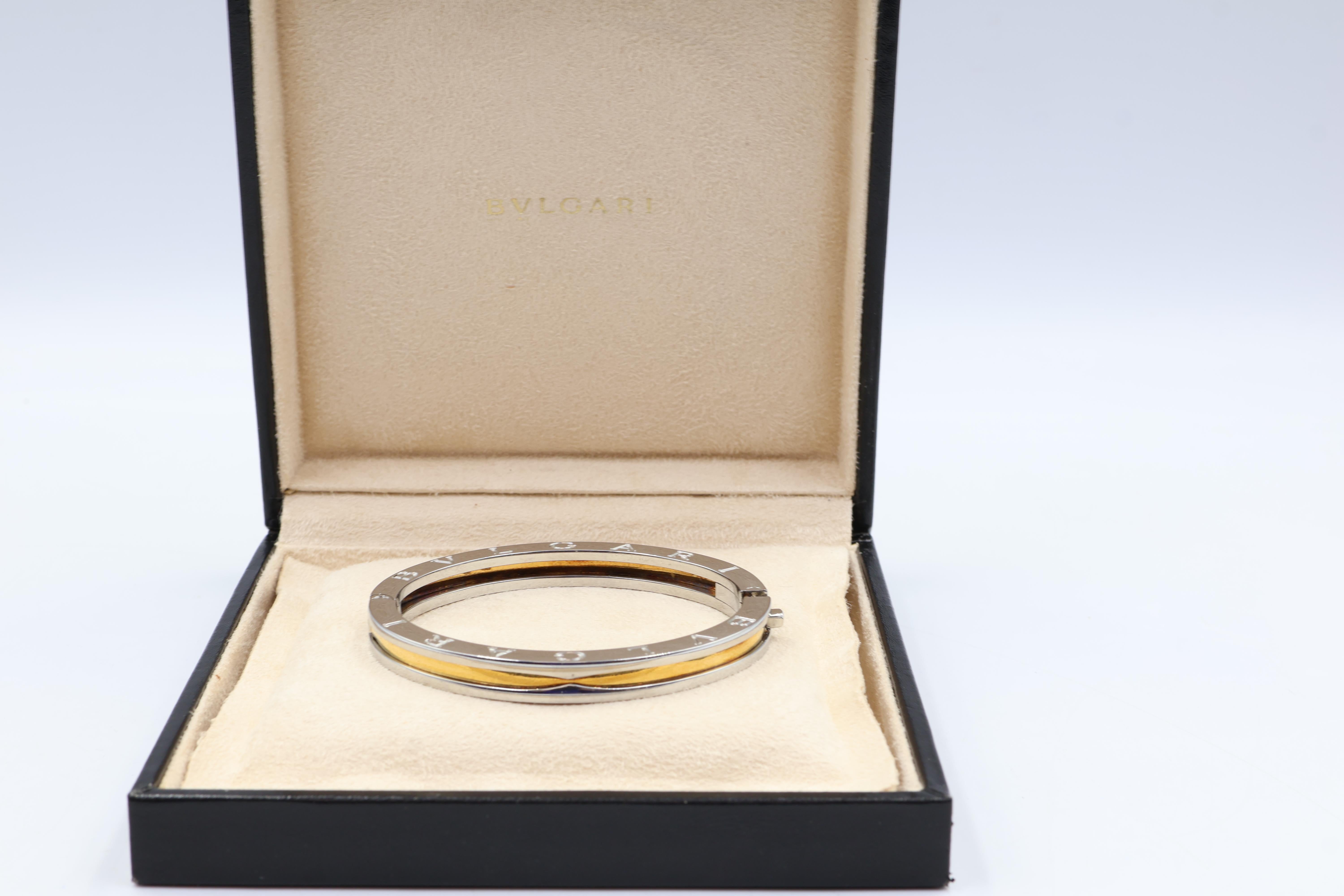 Crafted with sophistication, this Bvlgari B.zero1 bracelet merges the luster of 18k yellow gold with the sleek elegance of stainless steel. A true testament to modern design, its bangle style offers a seamless blend of contemporary flair and