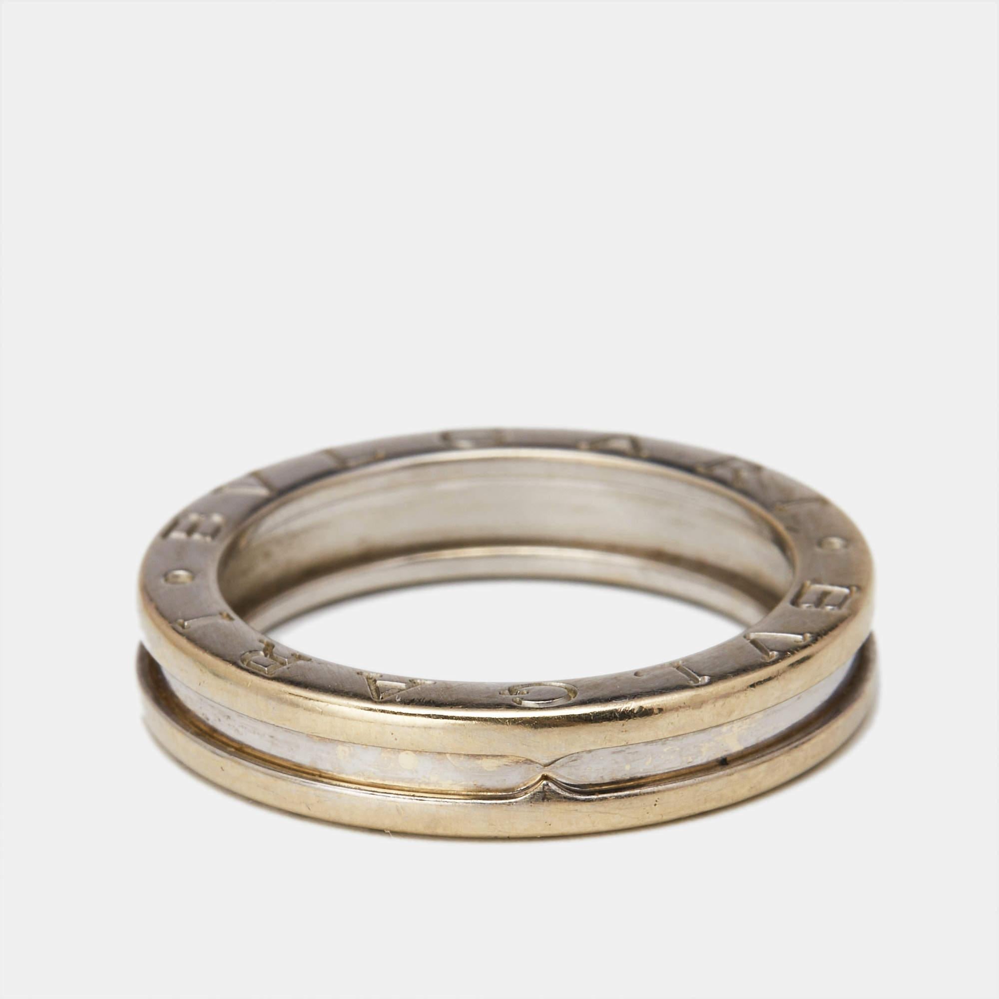 This charming B.Zero1 band ring is from one of Bvlgaris iconic collections. Beautifully crafted from 18k white gold in a one band style it is engraved with the BVLGARI logo. Inspired by the Colosseum this ring merges exceptional creative vision and