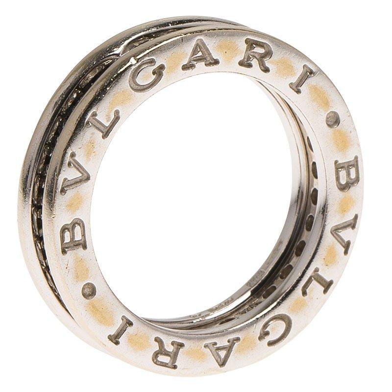 This stunning white gold band ring from Bvlgari features the brand’s name in engraving. Studded with pave diamonds in a design that merges modernity with eternity, this ring is crafted from 18 k white gold. The design derives inspiration from the