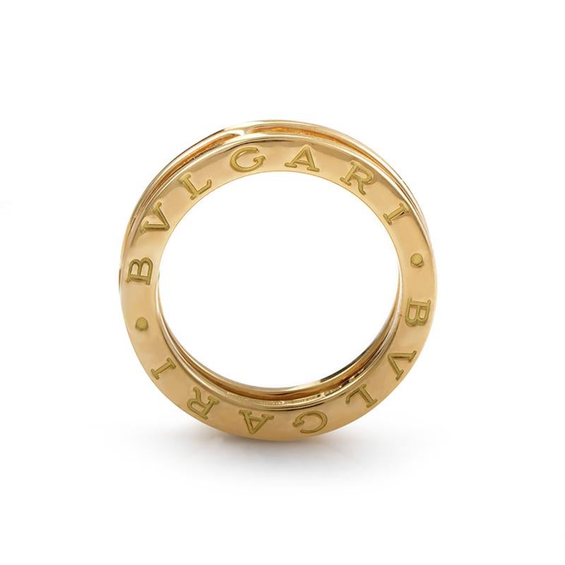 B.ZERO1 is the must-have BVLGARI collection. Its iconic and linear design features the central spiral and two lateral rims with the double logo engraved. This ring from the collection is made of 18K yellow gold and is set with a single row of