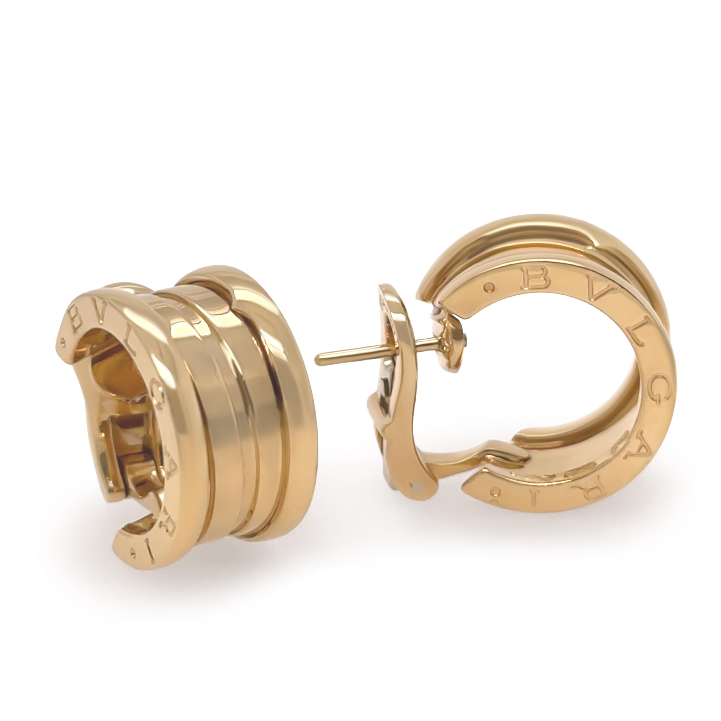 Ces boucles d'oreilles iconiques Bvlgari B.Zero1 sont réalisées en or jaune 18ct et présentent une finition polie ainsi que l'esthétique audacieuse caractéristique de la marque. Conçues pour le confort et le style, ces boucles d'oreilles sont