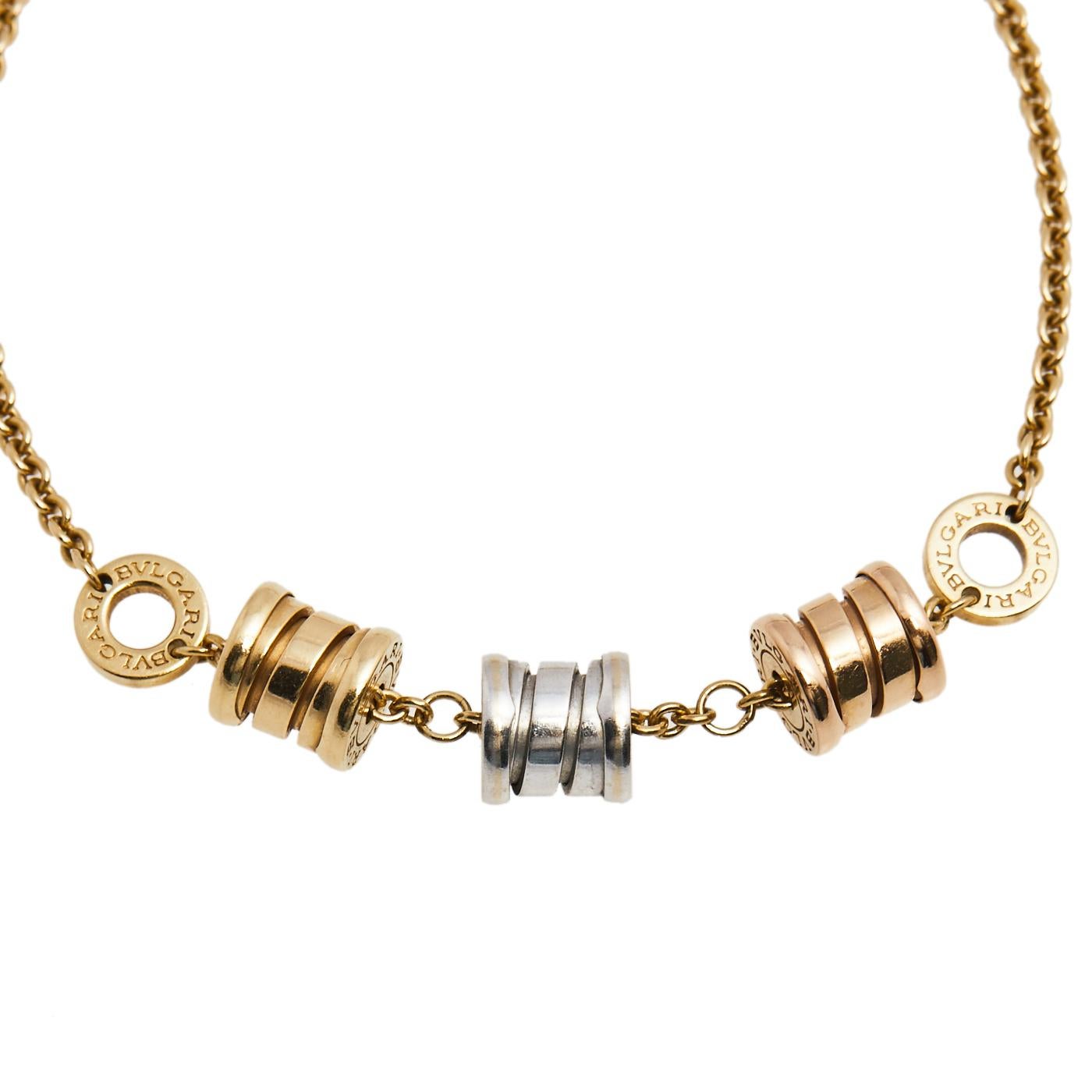 This Bvlgari bracelet is from the B.Zero1 collection and brings three signature spiral motifs in 18k white, yellow, and rose gold. A simple chain holds these instantly recognizable charms. Well-crafted and simply appealing, this creation is worth