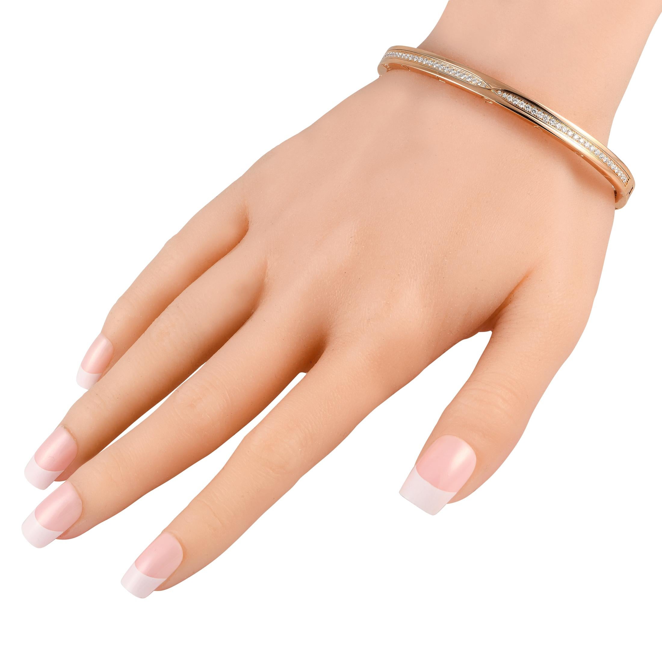 This impeccably crafted Bvlgari B.Zero bangle bracelet is a timeless piece that will never go out of style. The sleek, understated 18K Rose Gold setting comes to life thanks to a series of sparkling Diamonds totaling 1.41 carats and the luxury