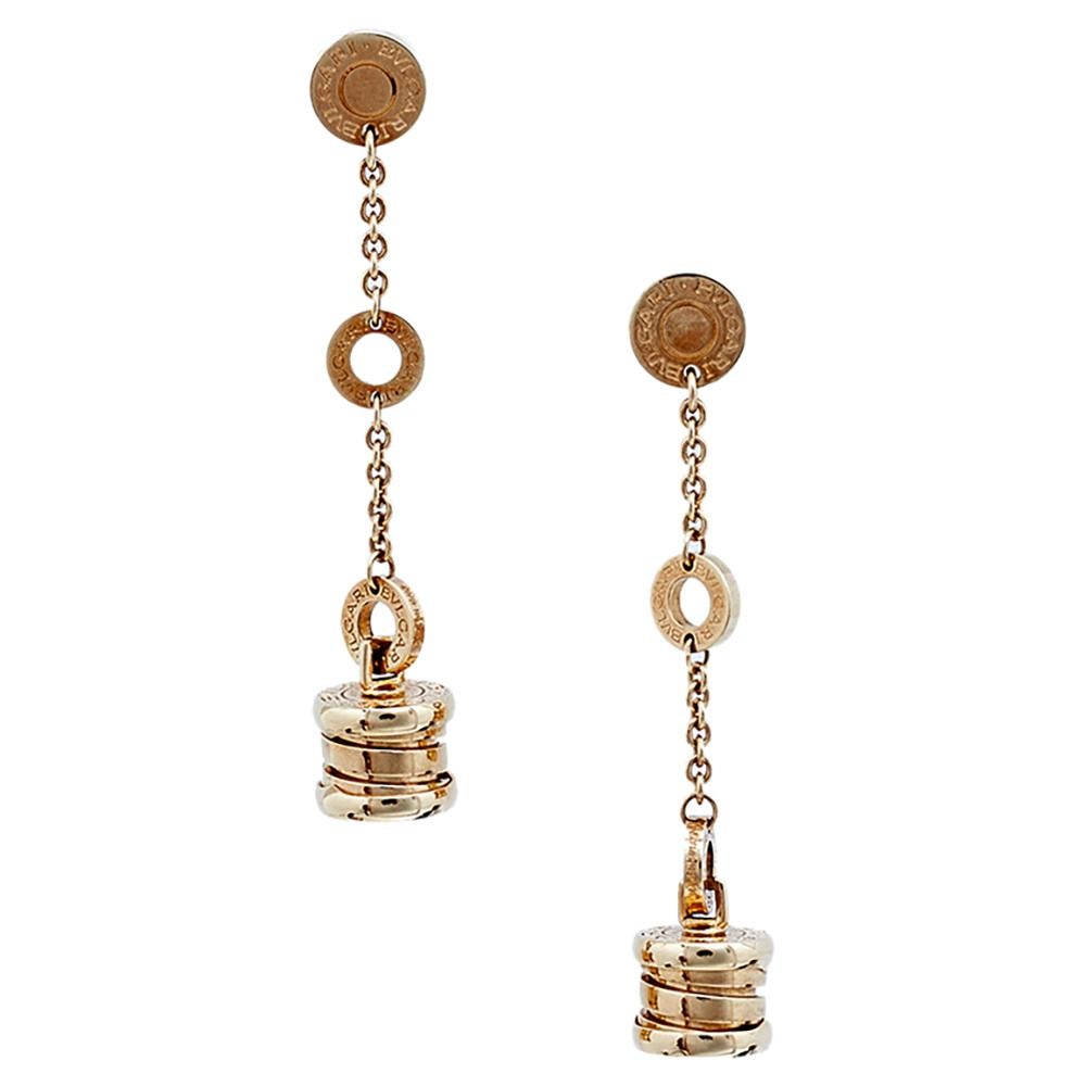 This lovely pair of earrings are by Bvlgari from the B Zero-1 collection. Crafted from solid 18K rose gold featuring a stud top with a chain-link attaching another ring to continue to the B Zero 1 motif strung through the hoops and dangling below.