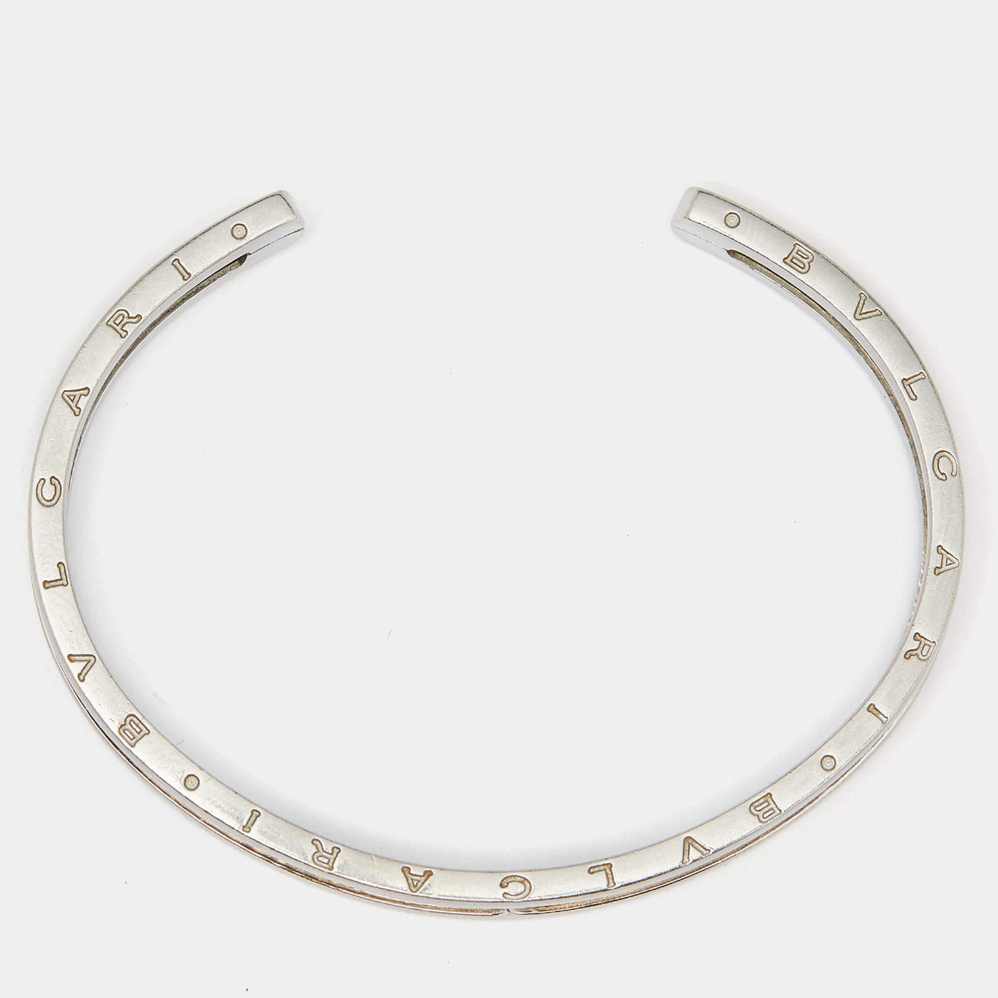 Adorn your wrist with this stunner of a bracelet from Bvlgari. The piece is from their B.Zero1 collection and it has been crafted from steel and beautifully lined with 18k rose gold along the center. It is complete with the brand's lettering on the