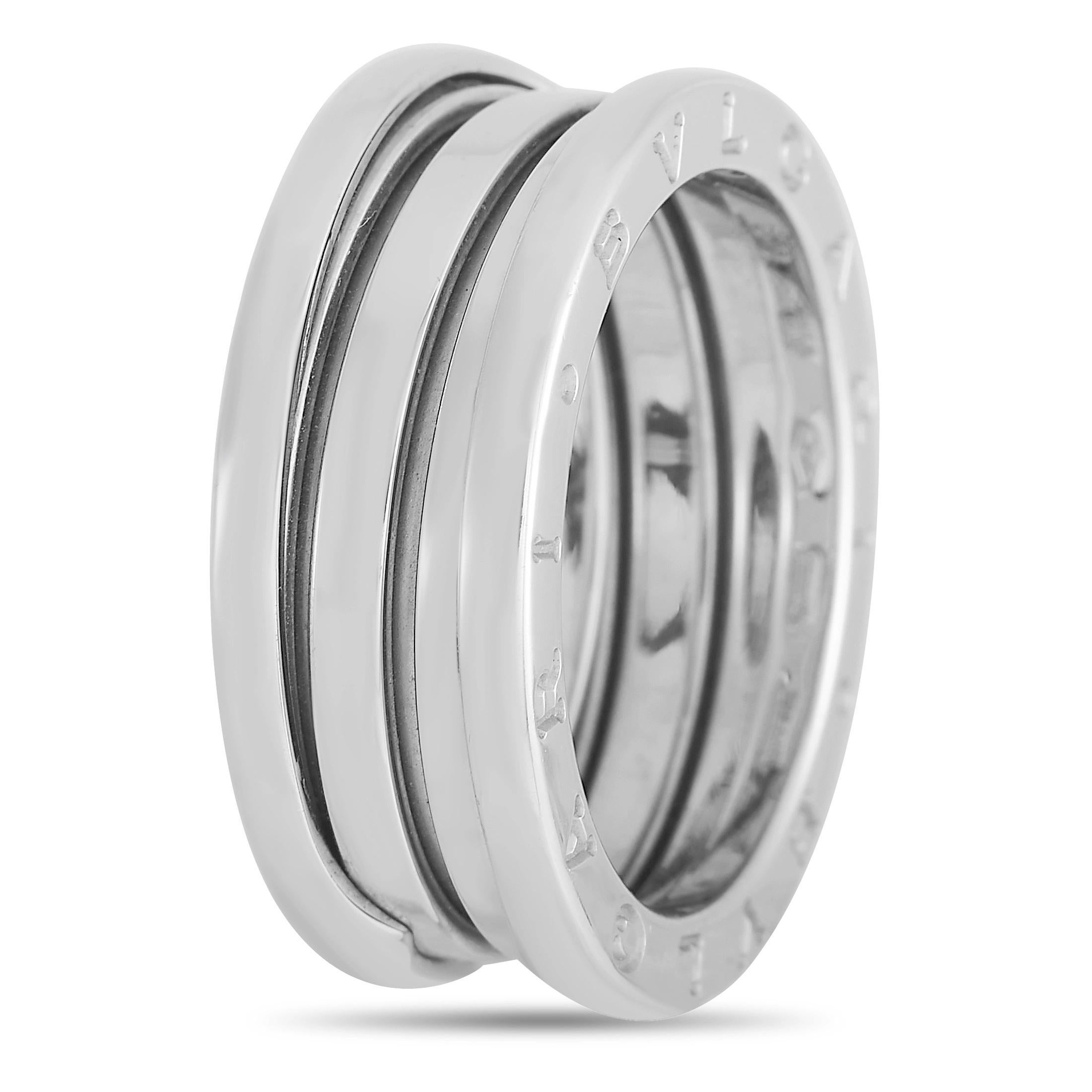 This Bvlgari B Zero 18K White Gold Ring is a unique offering. The design of this simple band was inspired by the Colosseum in Rome, reflecting its timeless nature. The band is made from 18K White Gold with a band thickness of 7 mm, and a total