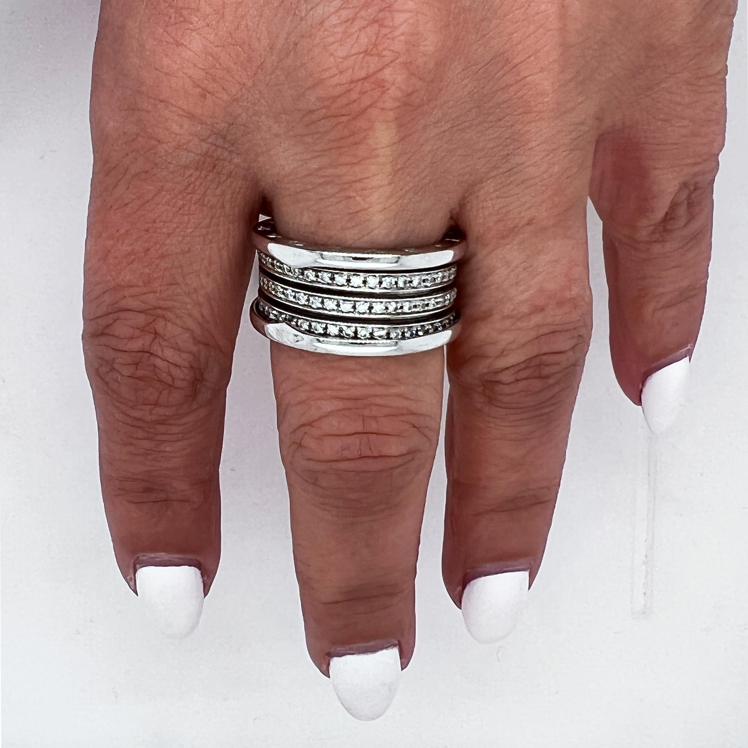 Bvlgari B.Zero1 18K White Gold Diamond Size 9 Band Ring

Diamonds are set in three rows, F-G color, VS clarity. 

10mm band width. Size 9. 

Comes with original Bvlgari box.
Retail: $10,000
Signed Bvlgari