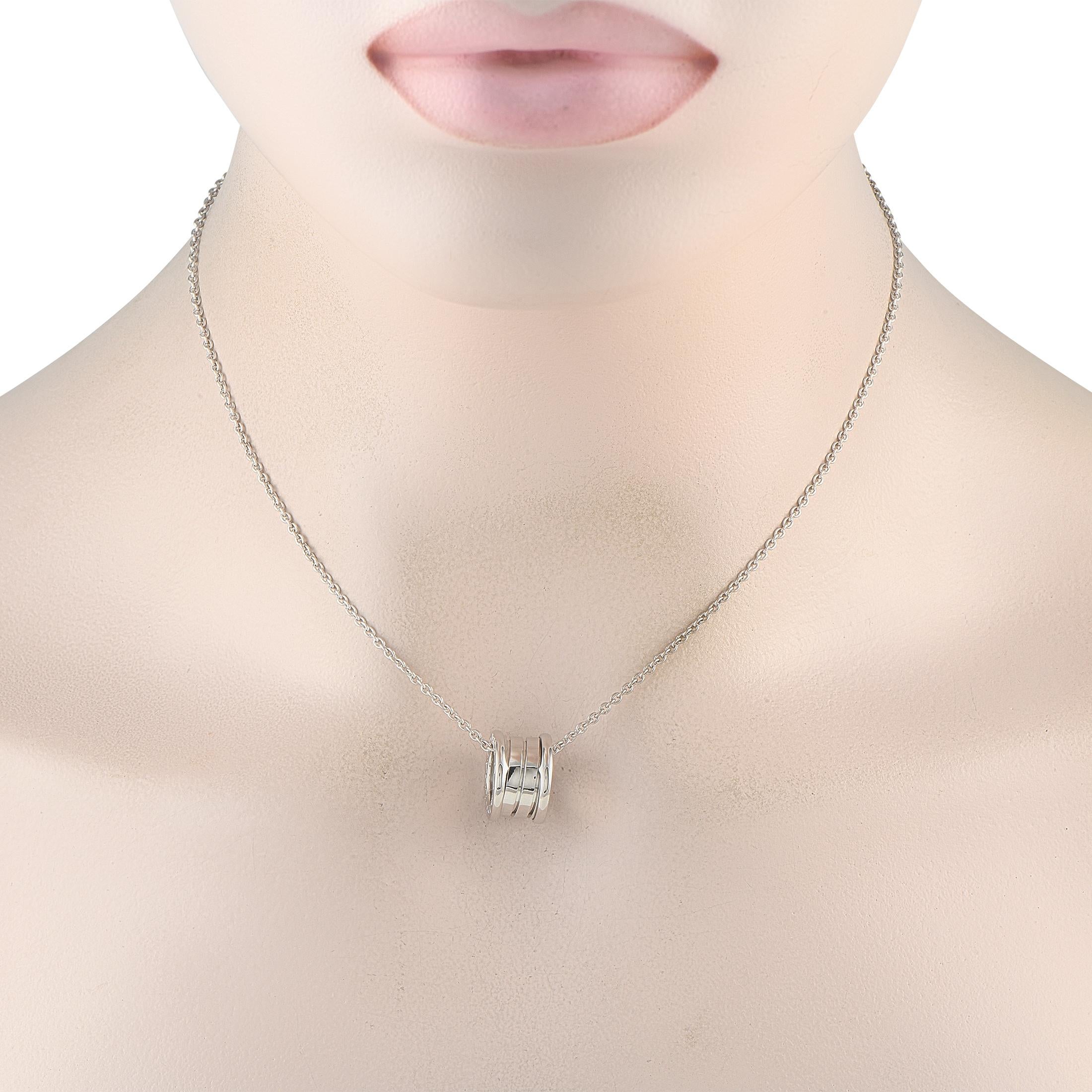 Chic and sophisticated, this Bvlgari B.Zero necklace will always make a statement. On this elegant piece, a circular pendant measuring 0.50 round is suspended from a 15 chain. Textured elements and the luxury brands signature engraved on the sides