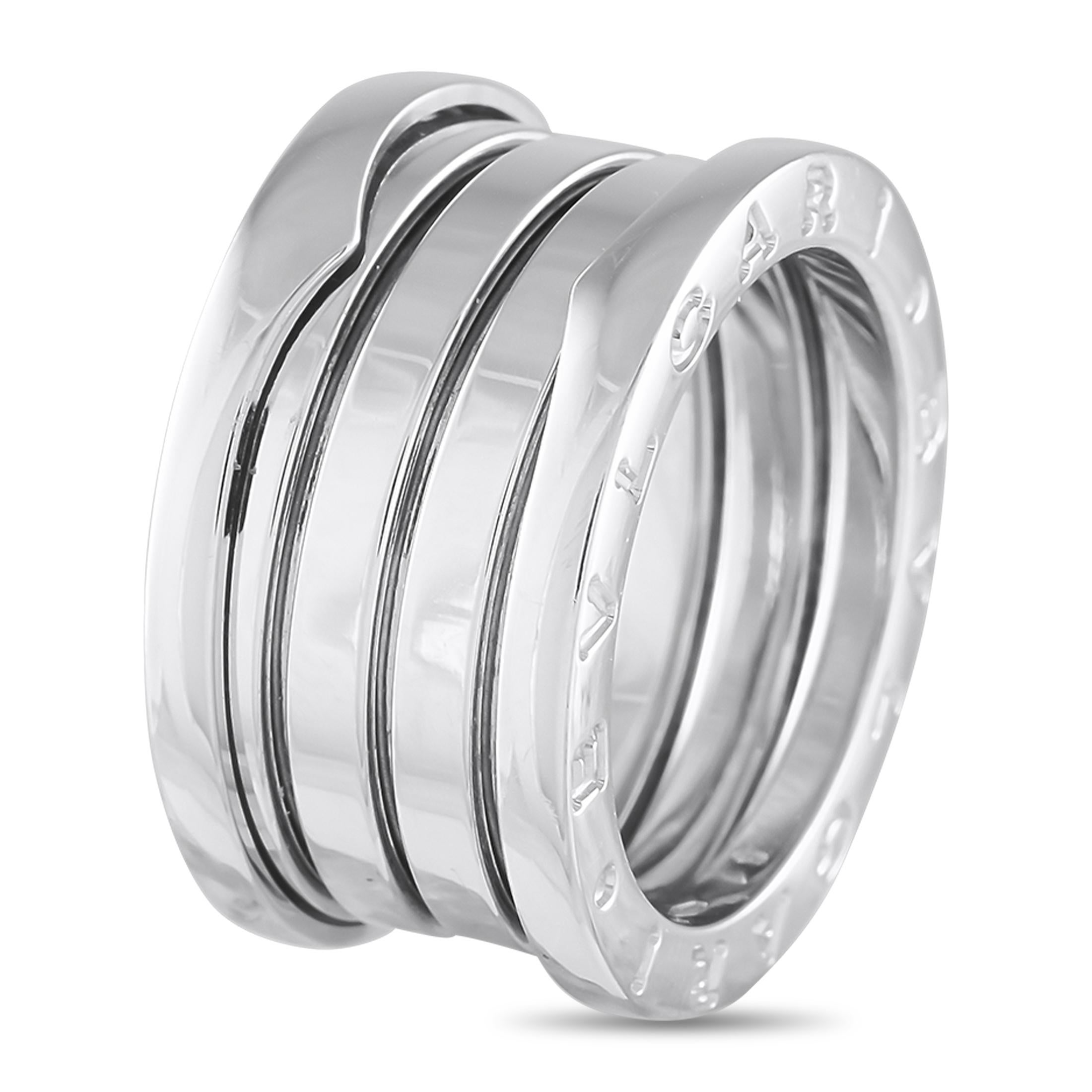 This 18K White Gold Bvlgari B.Zero1 ring is sleek, elegant, and perfectly unconventional. Like all pieces from this iconic collection, this bold accessory features a subtle spiral detail at the center and the brands signature engraved on each end.