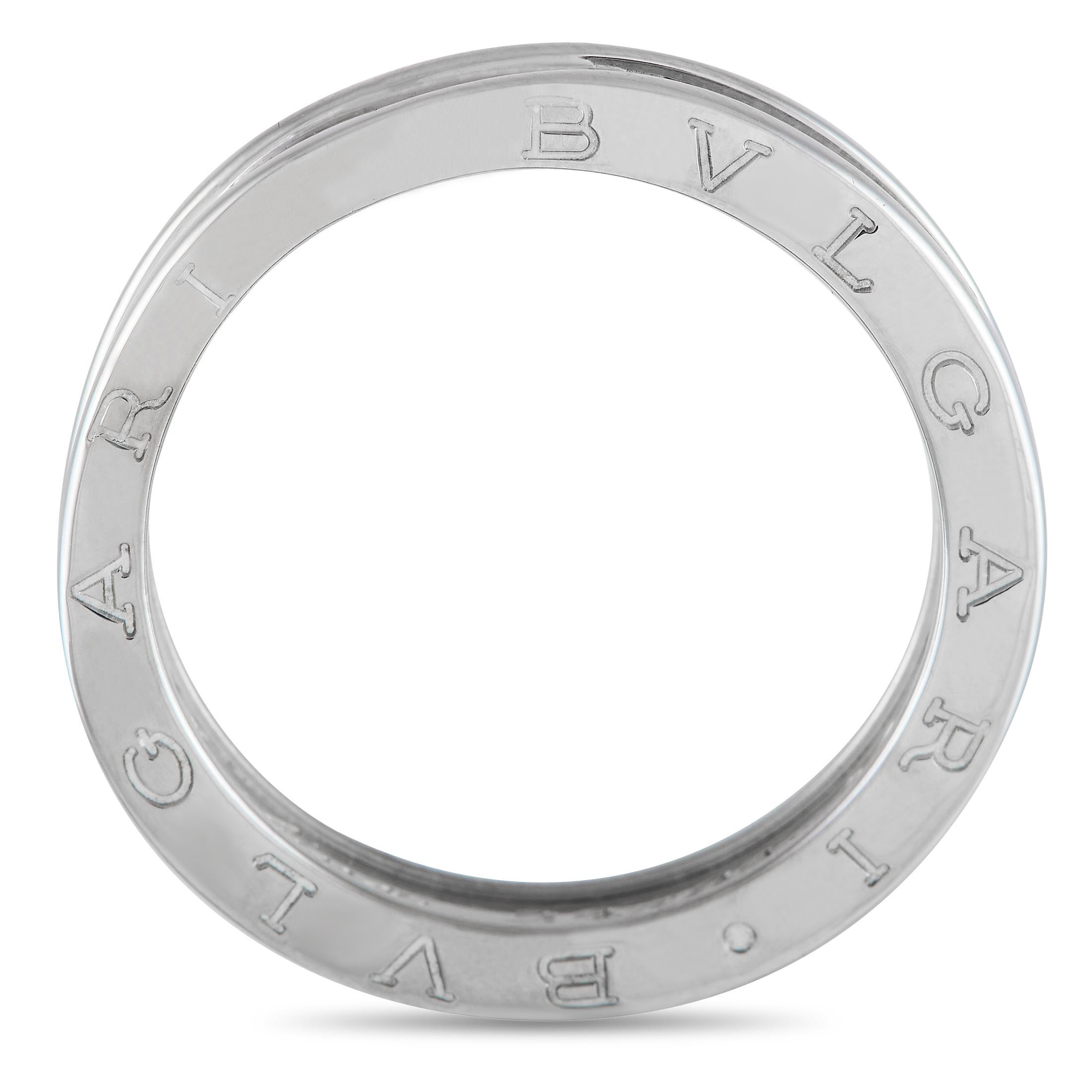 A simple yet bold ring suitable for all genders. The Bvlgari B.zero1 one-band ring is exquisitely crafted in 18K white gold. Its design is inspired by the curves and circular silhouette of the Colosseum in Rome. The band is engraved with the iconic