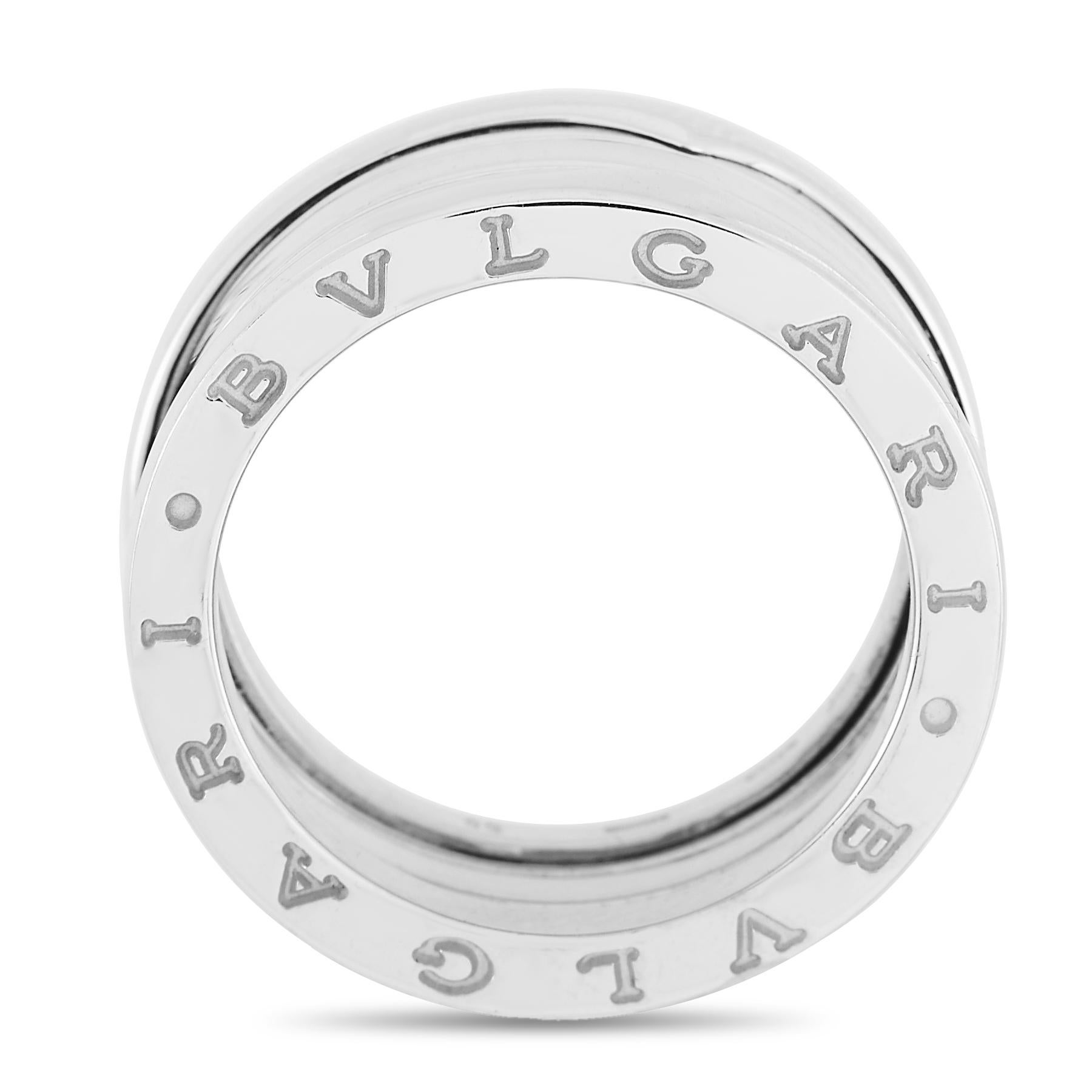 Sleek and modern in design, this ring from the Bvlgari B.Zero collection is a minimalist piece that will never go out of style. Crafted from 18K White Gold, it measures 9mm wide and features the band’s moniker engraved on the edges. 
 
 This jewelry