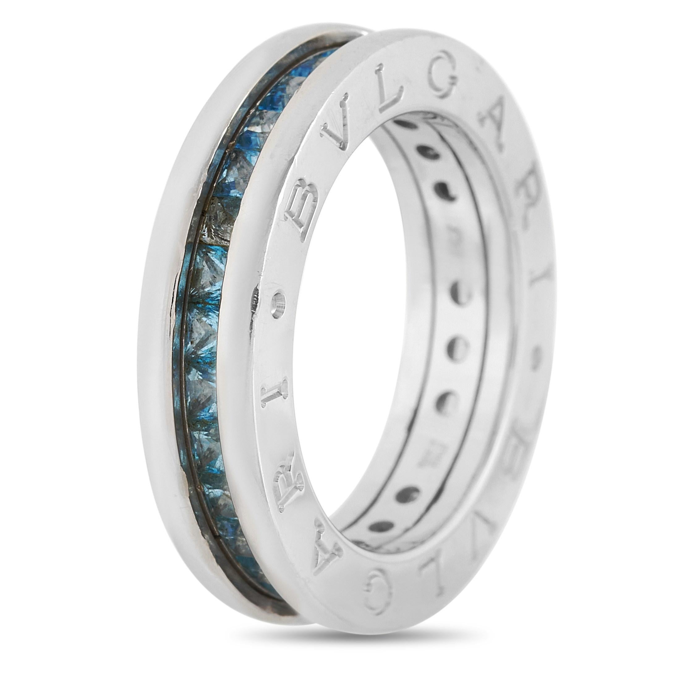 Raise your accessorizing game with this Bvlgari B.Zero1 18K White Gold Topaz Ring. It has the perfect mix of class and funk with its 5mm 18K white gold band decorated with a channel of stunning sparkling blue topaz gemstones. The ring weighs 7.8