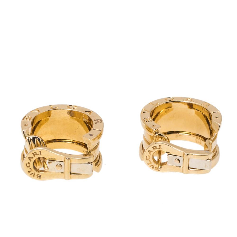 This pair of earrings is from Bvlgari's B.Zero1 collection, crafted from 18k yellow gold as hoops and beautifully detailed with the iconic band silhouette. They are complete with the brand's signature engravings. The collection has been designed by