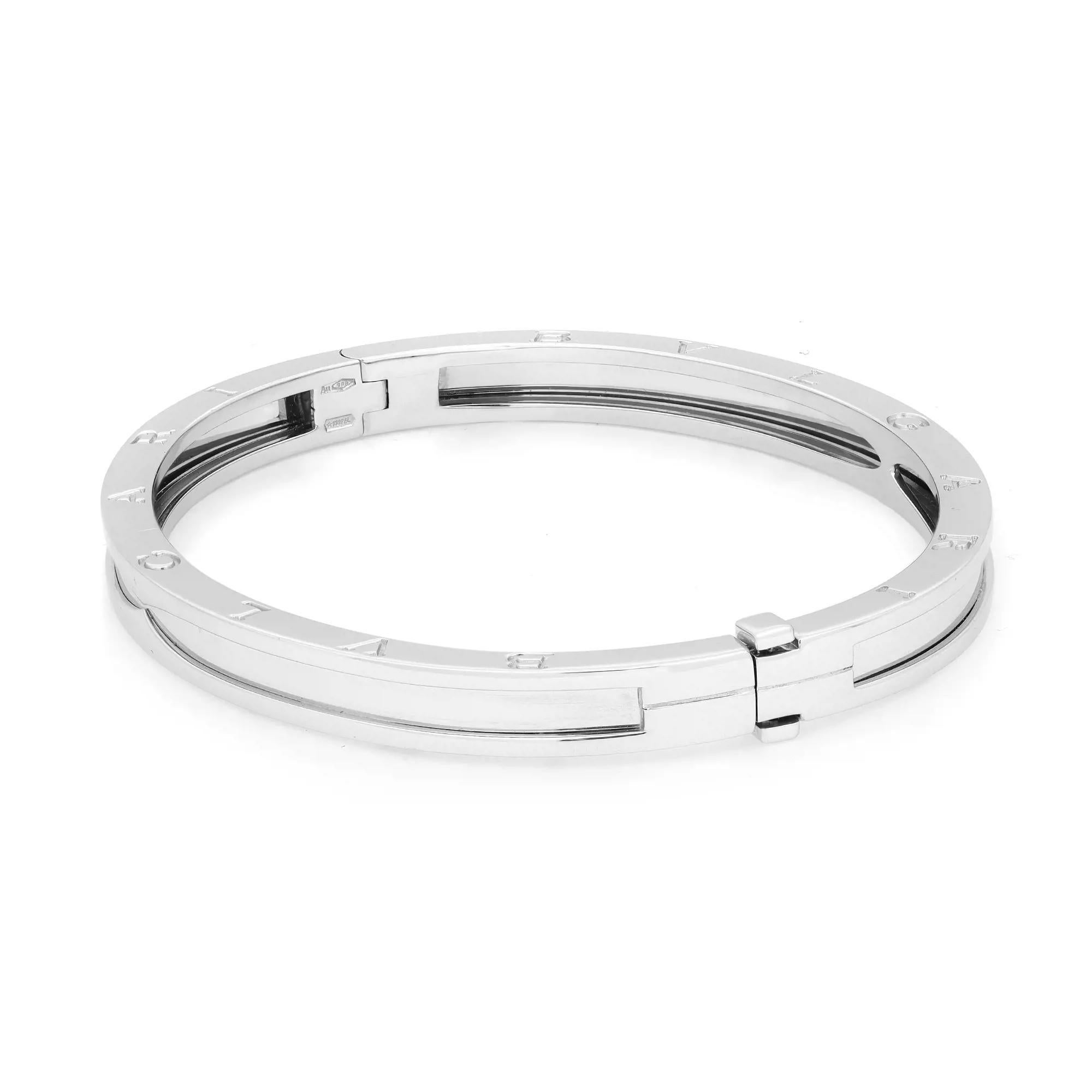 The B.Zero1 bangle bracelet is a true statement of Bvlgari’s creative vision. Well crafted in 18K white gold. This bracelet features Bvlgari logo engraving on the edges with a press on box closure. Size: Medium. Wrist measurement: 7 inches. Width: