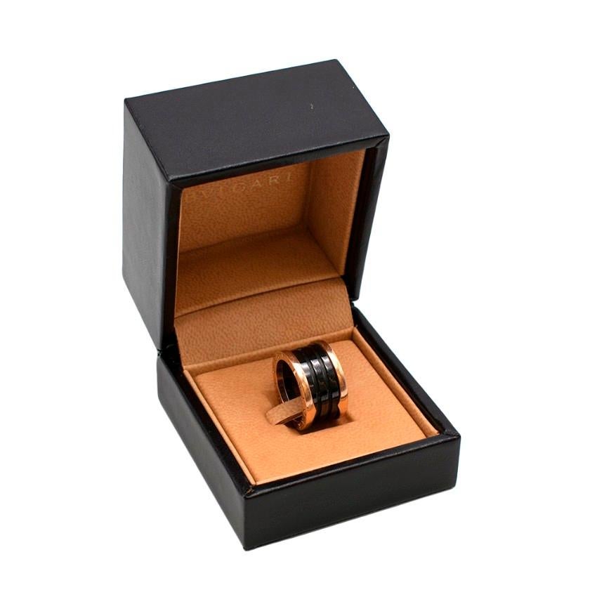 Bvlgari B.Zero1 Black & Rose Gold Enamel Ring

- Four Band Ring with 18kt Rose Gold Loops 
- Black Ceramic Spiral 
- Bvlgari Brand Engraving 

Material
- 18kt Rose Gold

Made in Italy 

Length: 1.3cm
Width: 0.4cm