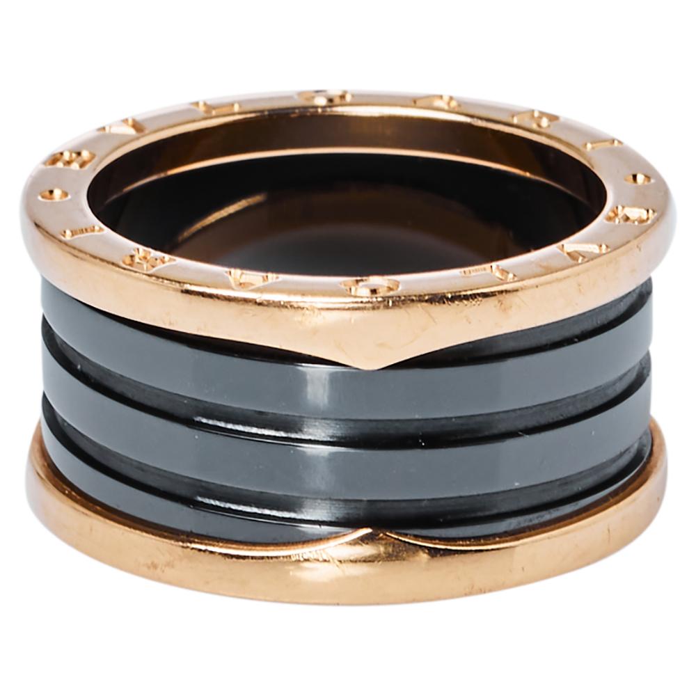 Exquisite details take center stage in this ring from Bvlgari. This B.Zero1 ring comes crafted from 18K rose gold, sculpted as a band, and flaunts 4 black ceramic bands stacked together. It has the brand name engraved on it. Wear it as a single
