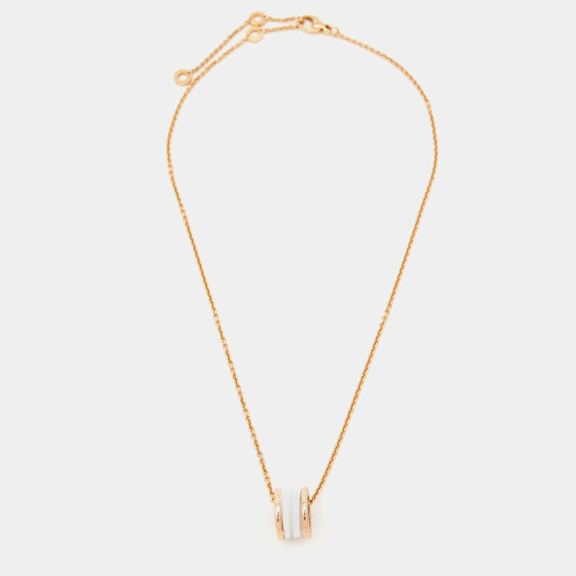 The Bvlgari B.Zero1 necklace effortlessly combines elegance and modernity. Crafted with precision, the pendant features the iconic spiral design in lustrous 18k rose gold, harmoniously complemented by sleek ceramic accents. A symbol of style and