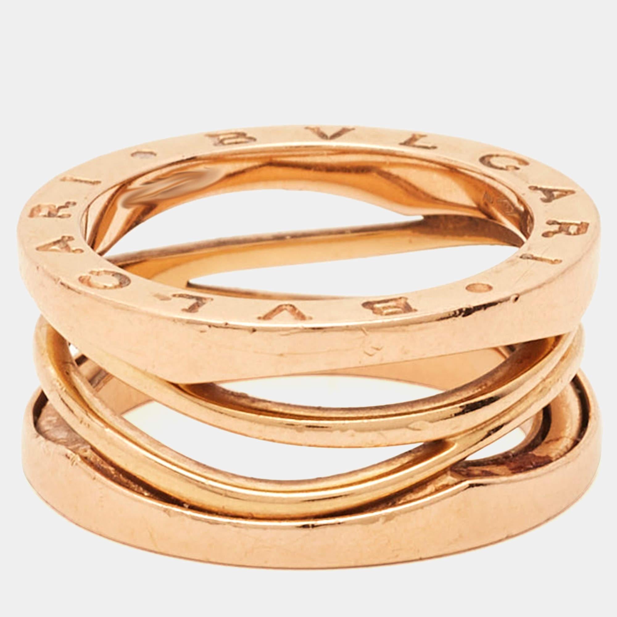 The Bvlgari B.Zero1 Design Legend ring is an exquisite piece of jewelry. Crafted in stunning 18K rose gold, this ring features three interlocking bands, symbolizing eternity and unity. Its iconic design showcases the brand's legendary craftsmanship