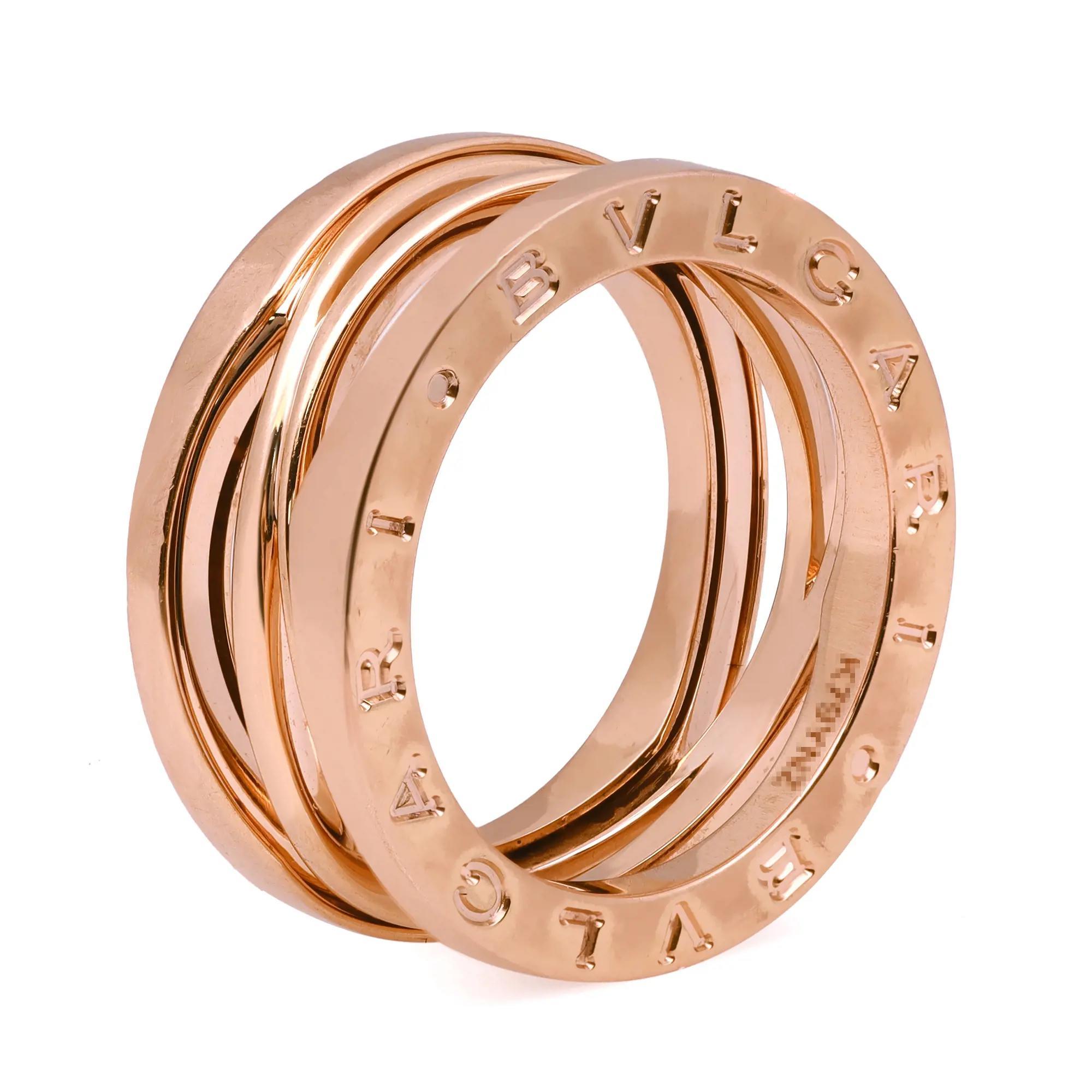 B.zero1 Design Legend jewelry is a perfect collision of modernity and tradition. Crafted in fine 18K rose gold. It features a clean modern three band ring engraved with the BVLGARI logo on both sides. This ring makes a great timeless and modern