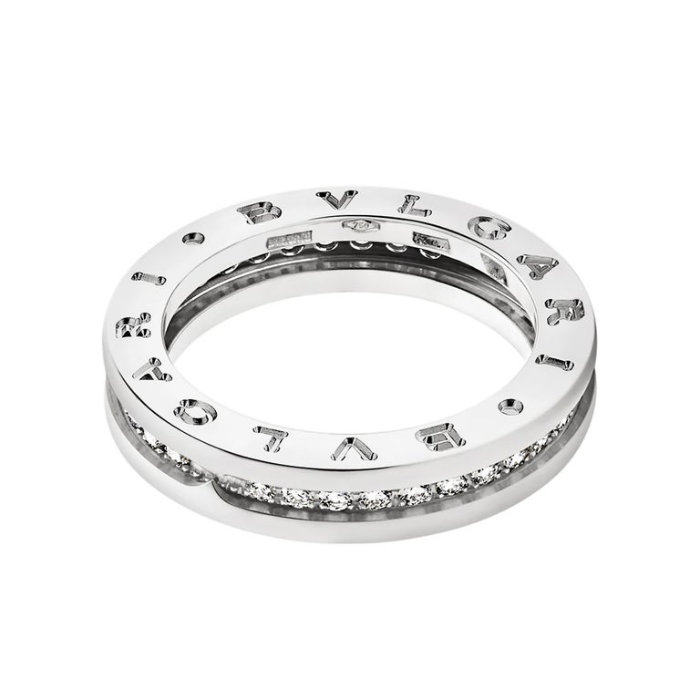 This unisex ring from Bulgari's iconic B.zero1 collection is crafted in 18ct white gold featuring a single band design engraved with the signature BVLGARI logo on both sides and pave set with 34 round brilliant cut diamonds weighing an estimated