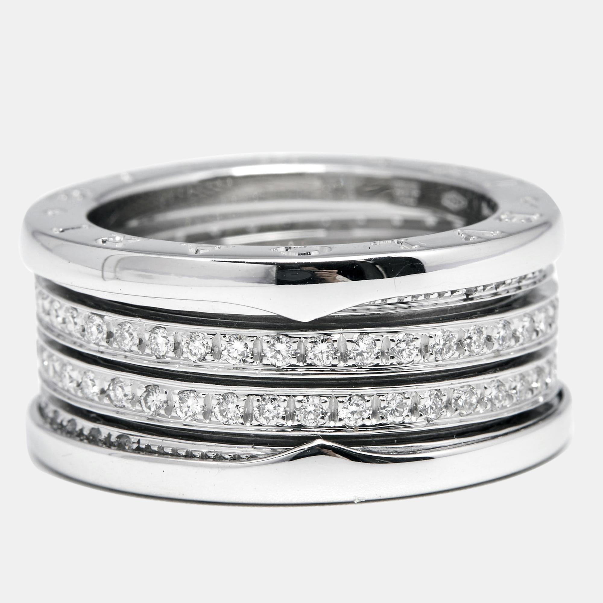 This exquisite Bvlgari B.Zero1 ring is truly beyond charming and precious. Crafted from 18K white gold and featuring middle bands accented with shimmering diamonds between a raised border engraved with 'Bvlgari' details, this ring is a work of art.