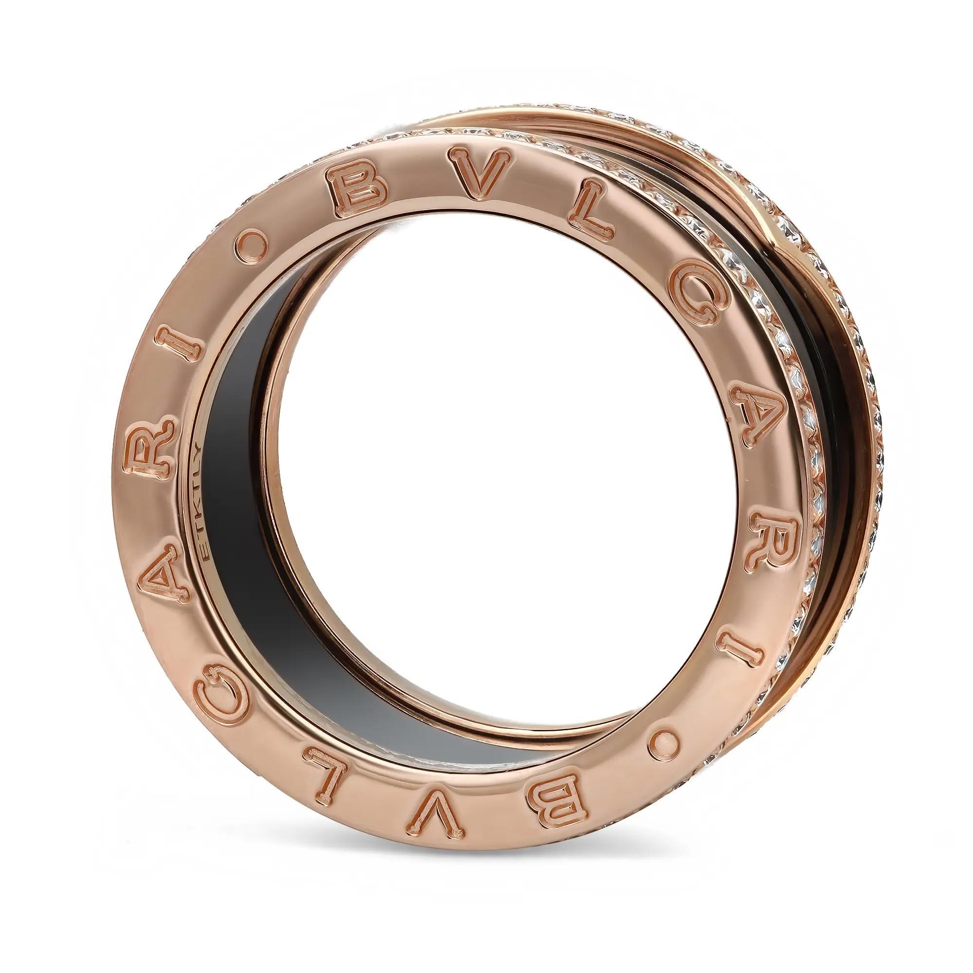 From the Bvlgari B.zero1 collection, this beautiful four-band ring is crafted in a lustrous 18K rose gold. It features a distinctive four-band spiral ring with pavé set round brilliant cut diamonds on the rims with the BVLGARI logo engraved on both
