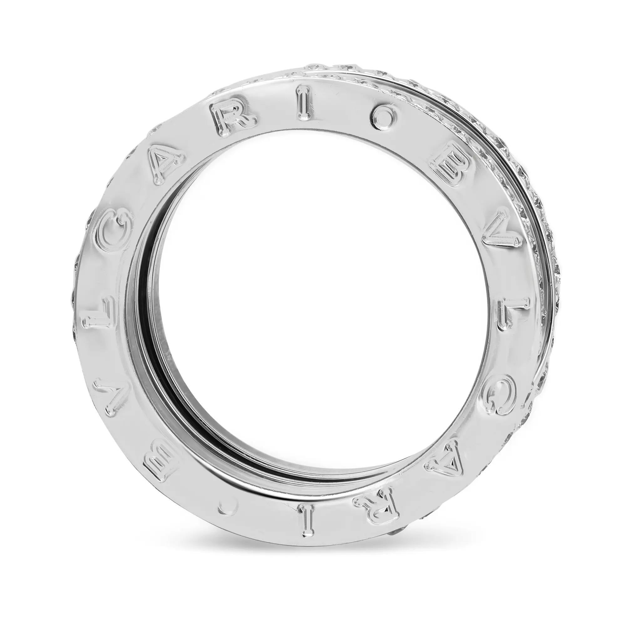 From the Bvlgari B.zero1 collection, this beautiful four-band ring is crafted in a lustrous 18K white gold. It features a distinctive four-band spiral ring with pavé set round brilliant cut diamonds on the rims with the BVLGARI logo engraved on both