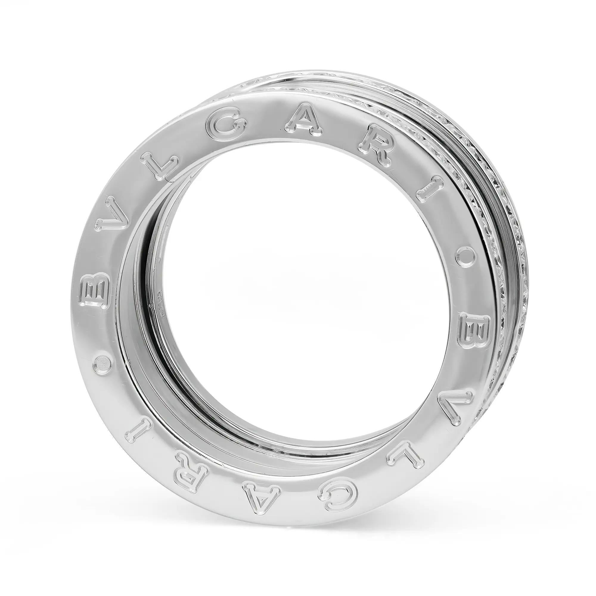 From the Bvlgari B.zero1 collection, this beautiful four-band ring is crafted in a lustrous 18K white gold. It features a distinctive four-band spiral ring with pavé set round brilliant cut diamonds on the rims with the BVLGARI logo engraved on both