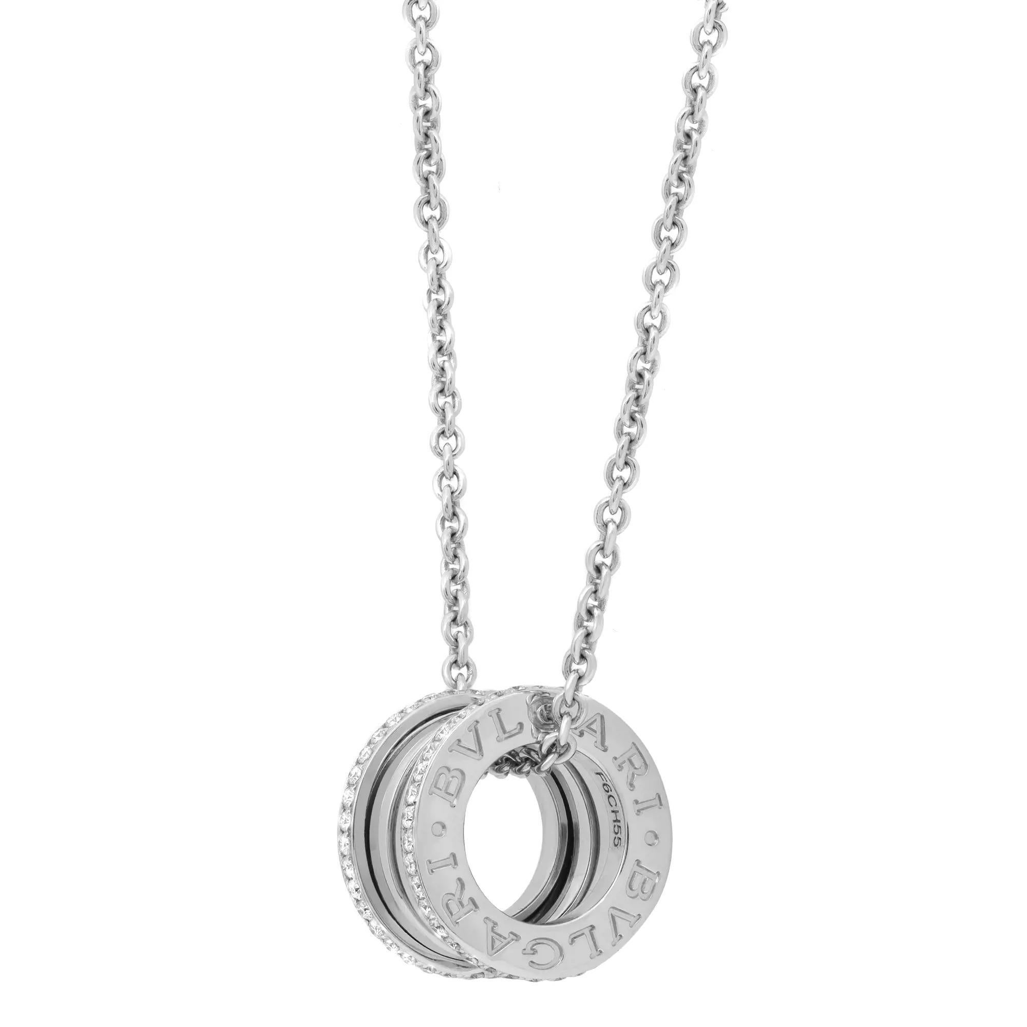 Bvlgari B.Zero1 diamond pendant necklace is a true statement of Bvlgari’s creative vision. Minimalist yet classy, this necklace accents almost every outfit with grace and panache. Crafted in fine 18K white gold. It features B.Zero1 pendant encrusted