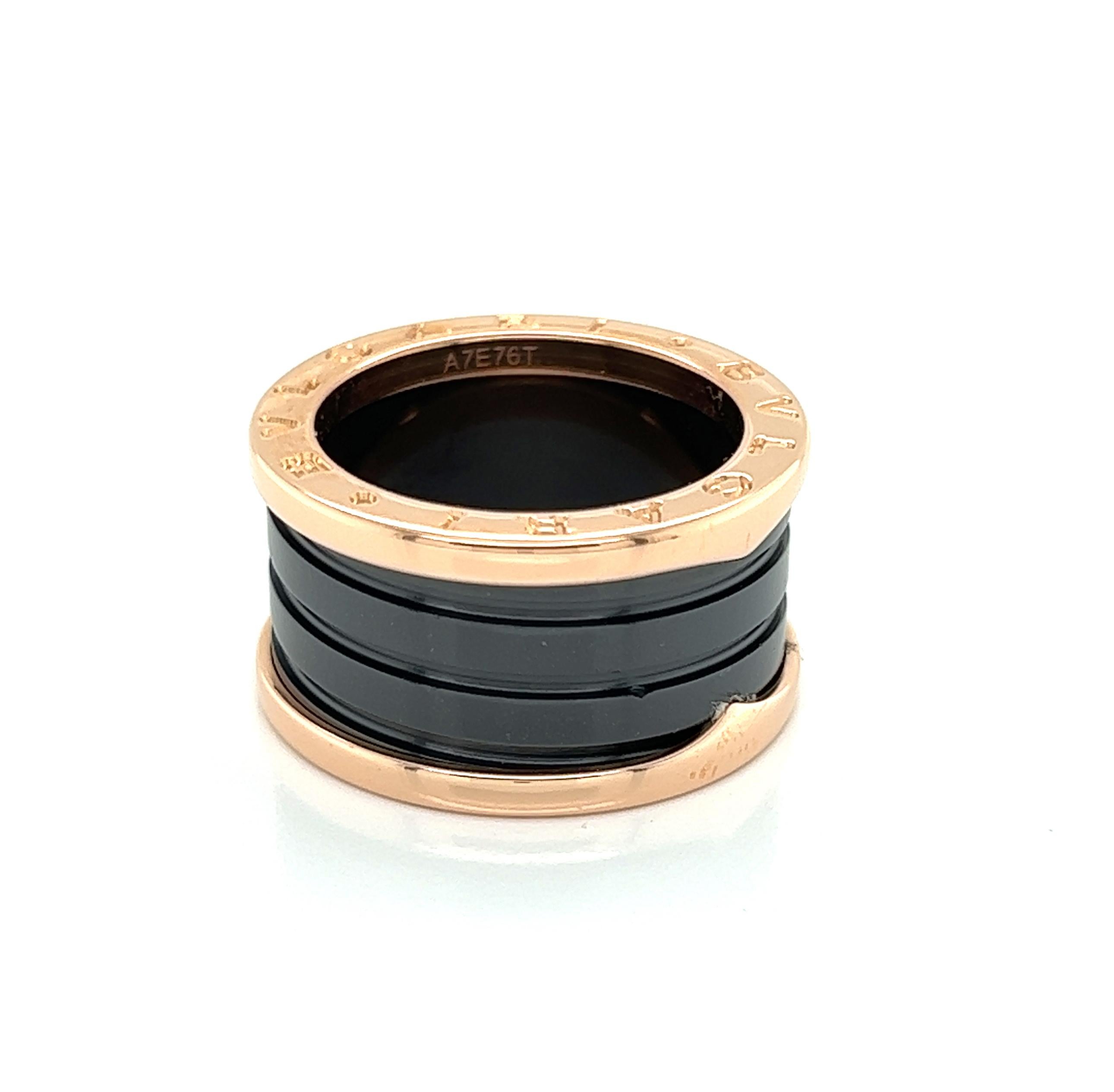Authentic four band ring B.zero1 Collection is by Bvlgari with two 18k rose gold loops & a black ceramic spiral, featuring the flat sides of the band engraved BVLGARI.  The band is signed by the designer gold content and ring size with serial